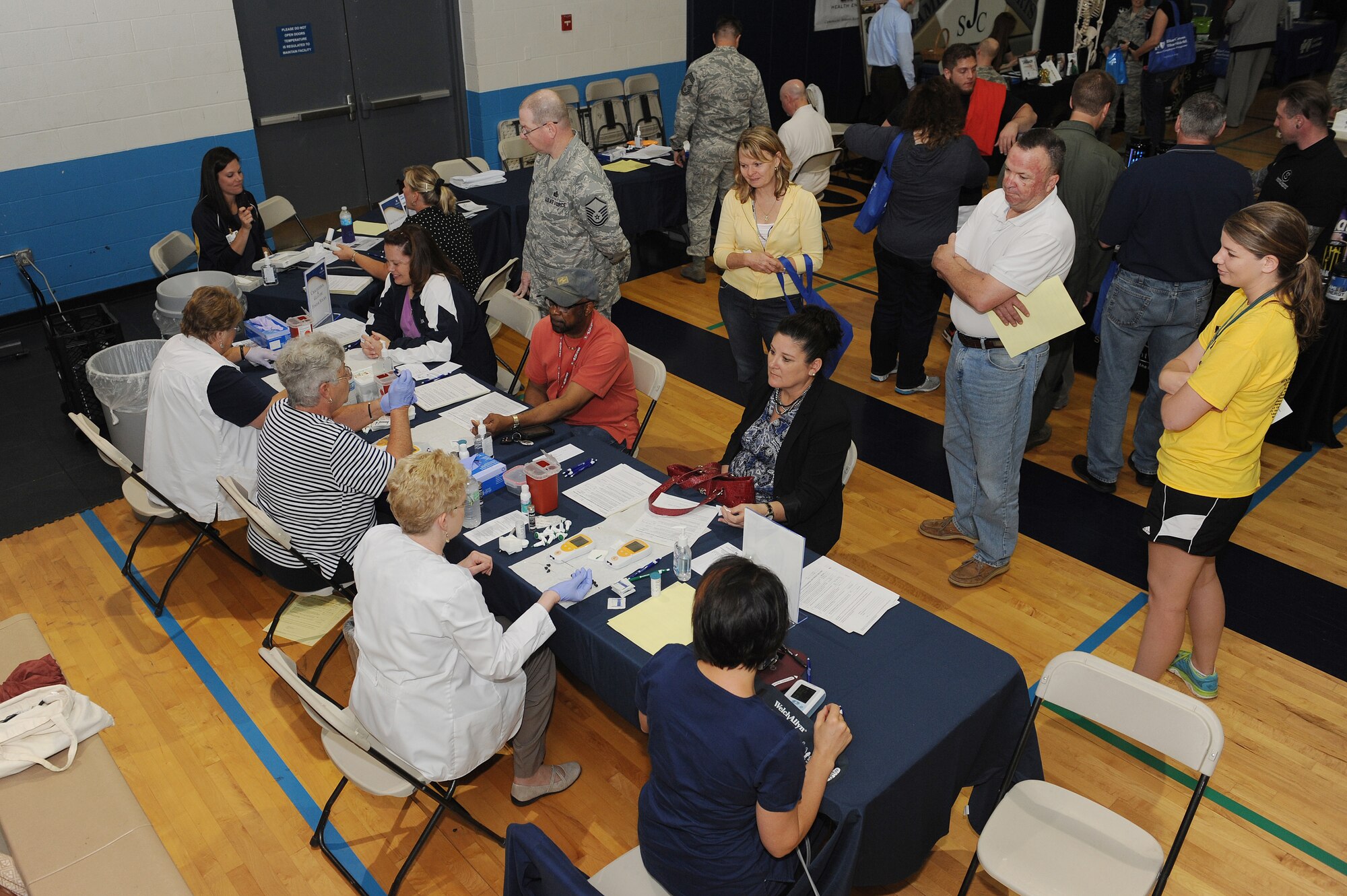 The James Sports Center hosted a fitness fair at Scott Air Force Base, Ill., May 9, 2014.  Patrons of the fair met with 30 vendors and discussed health and fitness related topics.  Some vendors included nurses from a local hospital, who checked people’s blood pressure, glucose and cholesterol levels, and bone density.  The fair had raffles, giving away prizes, including baseball tickets and gift certificates. (U.S. Air Force photo/Staff Sgt. Maria Bowman)