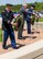 During the Police Week wreath-laying ceremony held May 13, 2014, at the Russell-Knox Building, Quantico, Va., four wreaths were displayed in honor of fallen members. From left to right, representatives from the U.S. Army Criminal Investigation Command, the Naval Criminal Investigative Service, Brig. Gen. Keith M. Givens, commander, Air Force Office of Special Investigations, and Defense Security Services. 