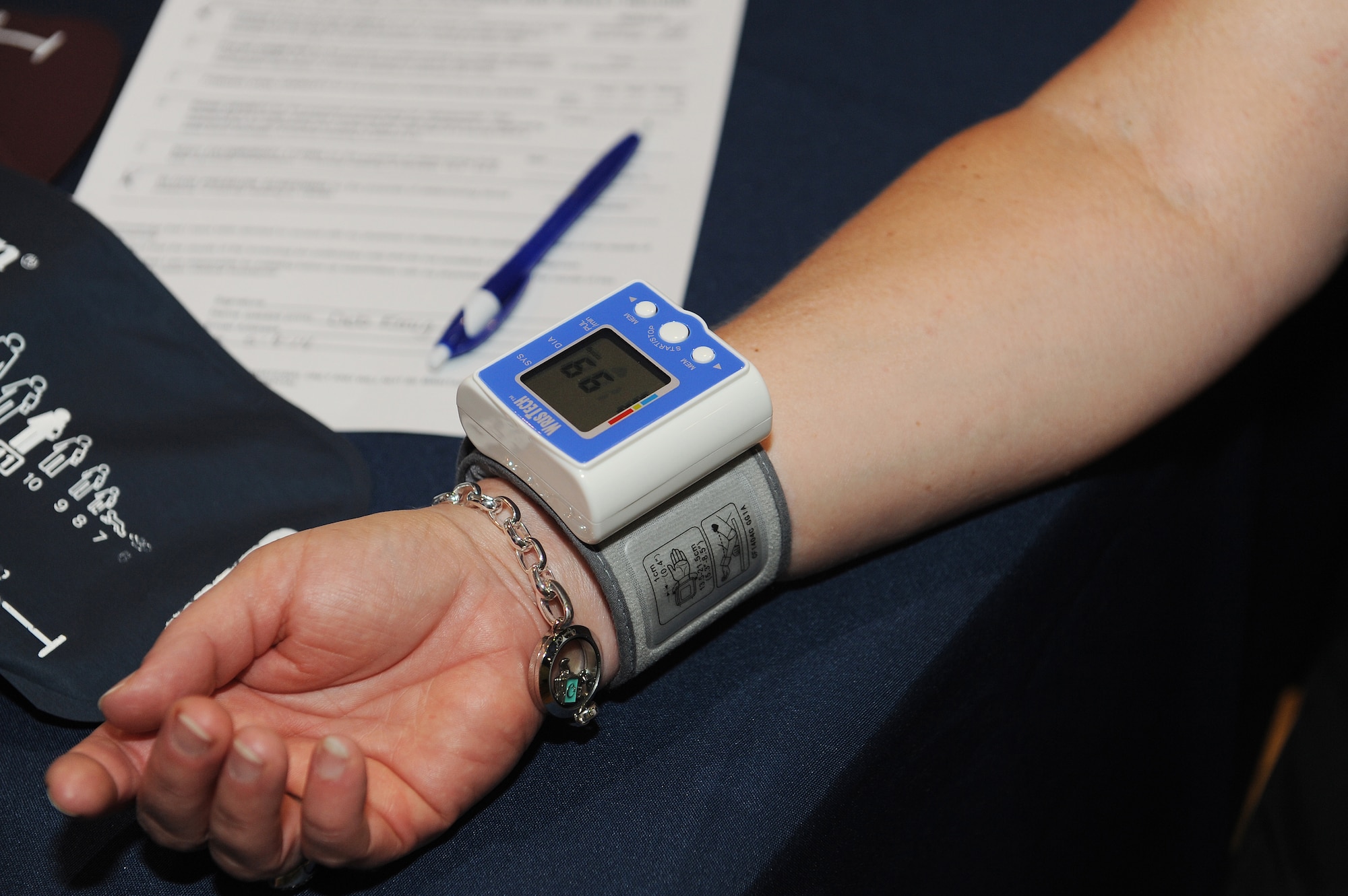 A patron of the fitness fair has her blood pressure checked out at Scott Air Force Base, Ill., May 9, 2014.  Nurses from a local hospital checked people’s cholesterol and glucose levels, bone density, to see if there was a risk of developing osteoporosis.  In addition to checking basic health assessments, guests had the opportunity to win giveaways and prizes, including baseball tickets, golf certificates and gift cards. (U.S. Air Force photo/Staff Sgt. Maria Bowman)