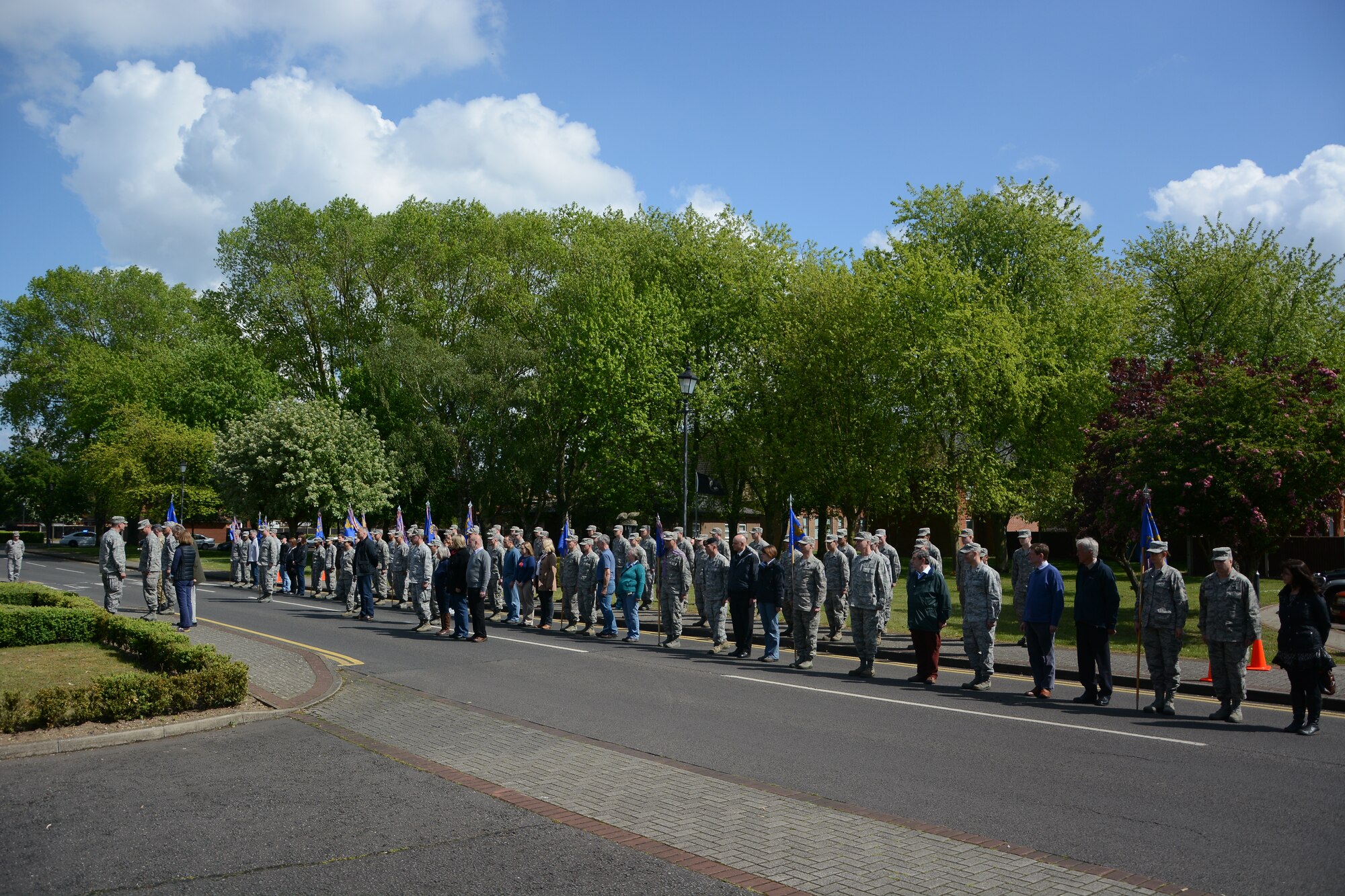 U.S. Air Force Col. Kenneth T. Bibb Jr., far left, 100th Air Refueling Wing commander, addresses a modified formation after a retreat ceremony for Honorary Commanders’ Day May 13, 2014, on RAF Mildenhall, England. Local community leaders joined the modified formation to experience the ceremony and to wrap up the day’s events. (U.S. Air Force photo by Senior Airman Micaiah Anthony/Released)