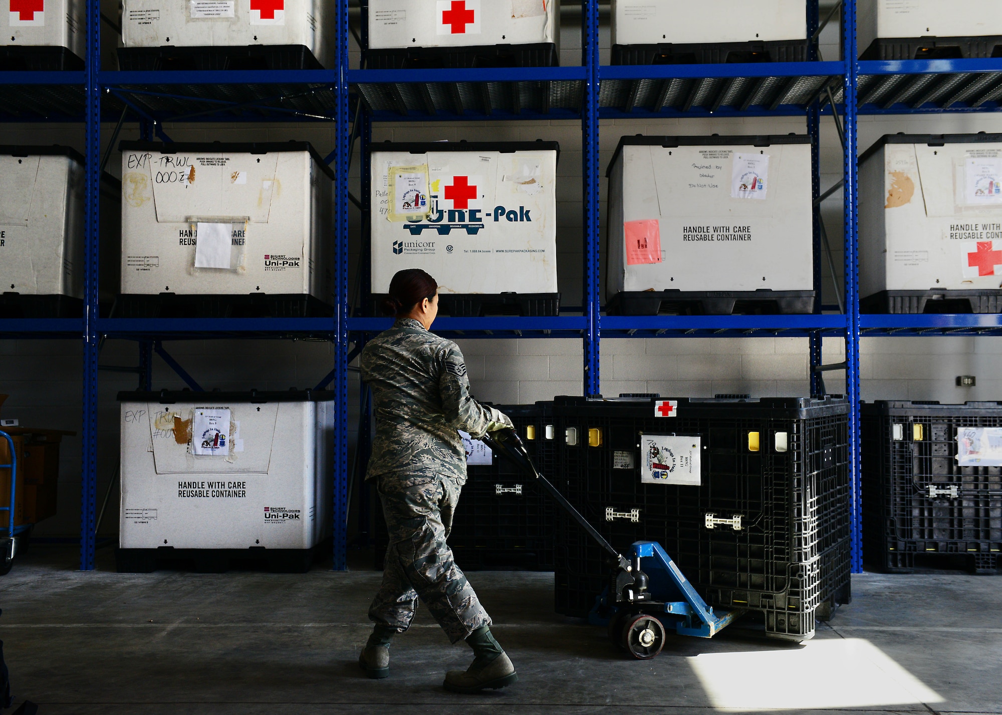 Staff Sgt. Prapaporn Wangsuttisomsri, 31st Medical Support Squadron medical logistics technician, pulls out a pallet of medical supplies from the war reserve material warehouse, May 12, 2014, at Aviano Air Base, Italy. The responsibility of stocking, preparing and shipping more than $6 million worth of equipment and supplies falls upon medical logistics Airmen tasked with the preservation of medical supplies that could one day save a life. (U.S. Air Force photo/Airman 1st Class Ryan Conroy)    