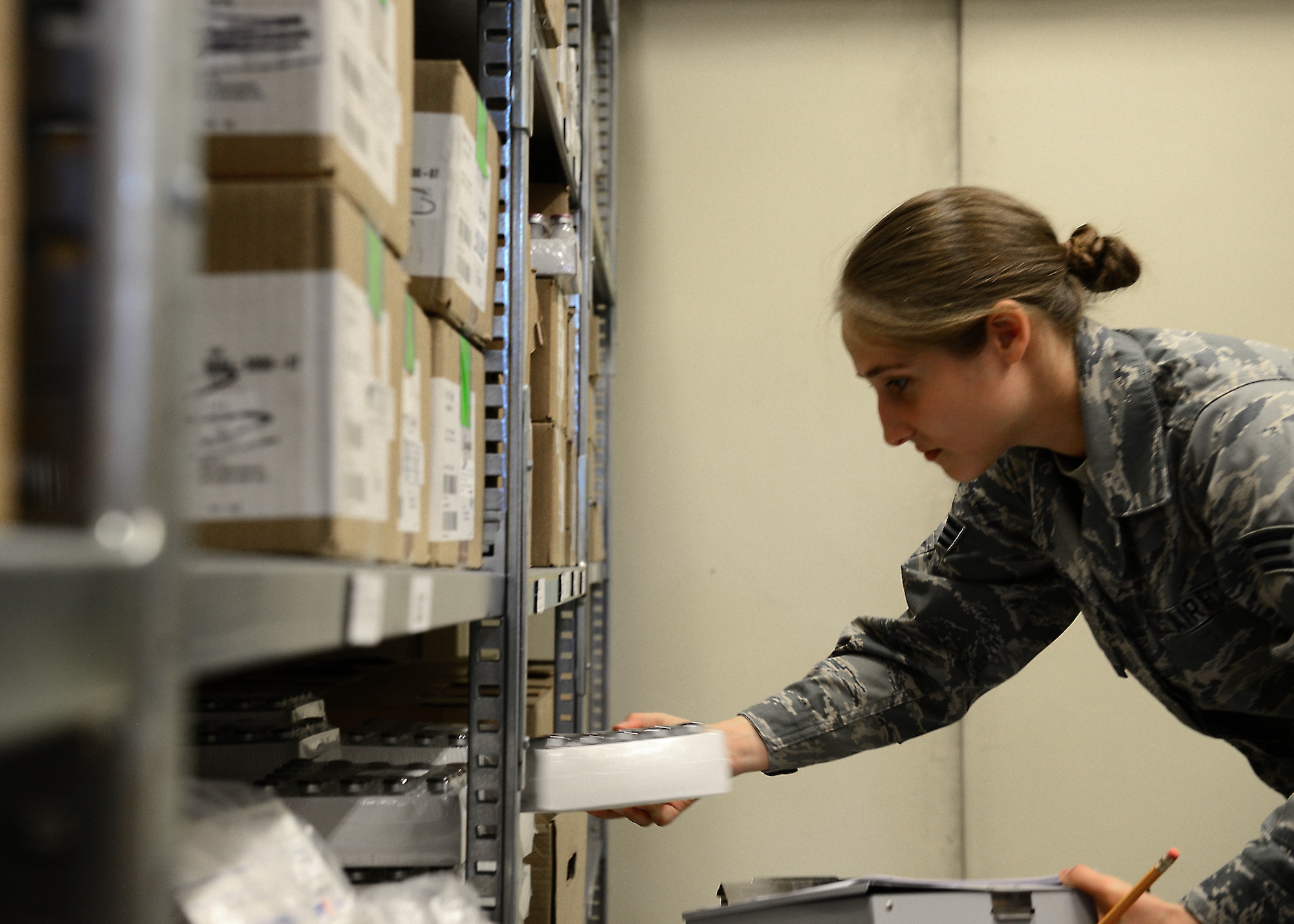 Senior Airman Megan Grose, 31st Medical Support Squadron medical logistics technician, inventories medication, May 12, 2014, at Aviano Air Base, Italy. Preparation is the key for medical logistics technicians who ship and stock these supplies, which are used to treat patients and are shipped out in major catastrophes locally or downrange. (U.S. Air Force photo/Airman 1st Class Ryan Conroy)   