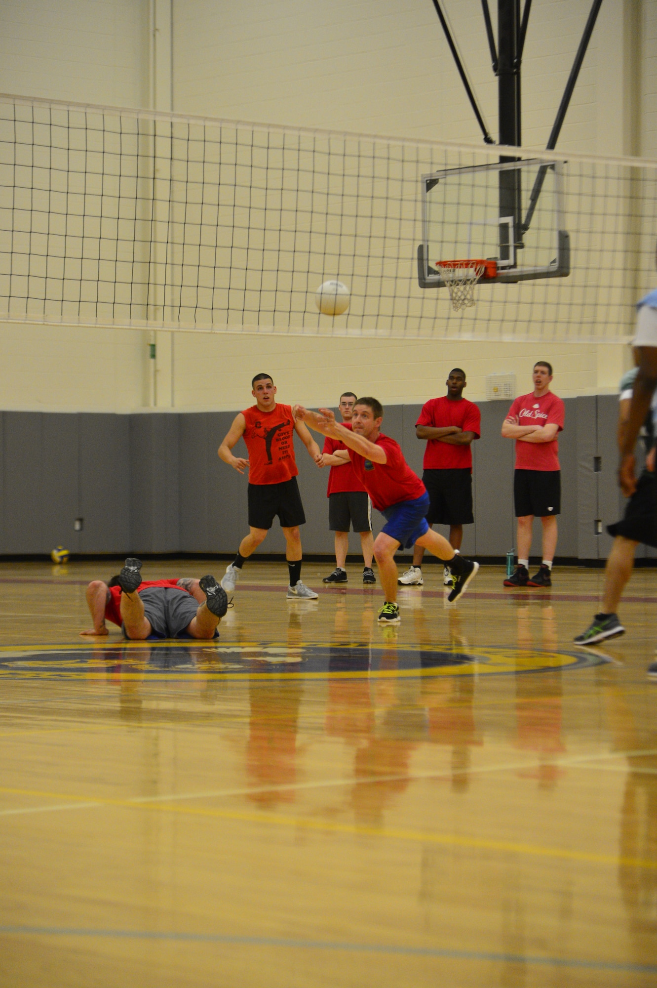 Russ Lowery, 436th Logistics Readiness Squadron volleyball team, dives for a ball during an intramural volleyball game May 13, 2014, at the fitness center on Dover Air Force Base, Del. The 436th LRS handed the 436th/736th Aircraft Maintenance Squadron its first loss of the season. (U.S. Air Force photo/Airman 1st Class Zachary Cacicia)