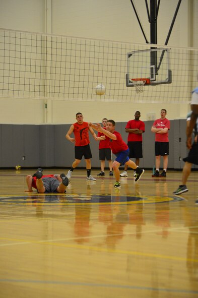 Russ Lowery, 436th Logistics Readiness Squadron volleyball team, dives for a ball during an intramural volleyball game May 13, 2014, at the fitness center on Dover Air Force Base, Del. The 436th LRS handed the 436th/736th Aircraft Maintenance Squadron its first loss of the season. (U.S. Air Force photo/Airman 1st Class Zachary Cacicia)