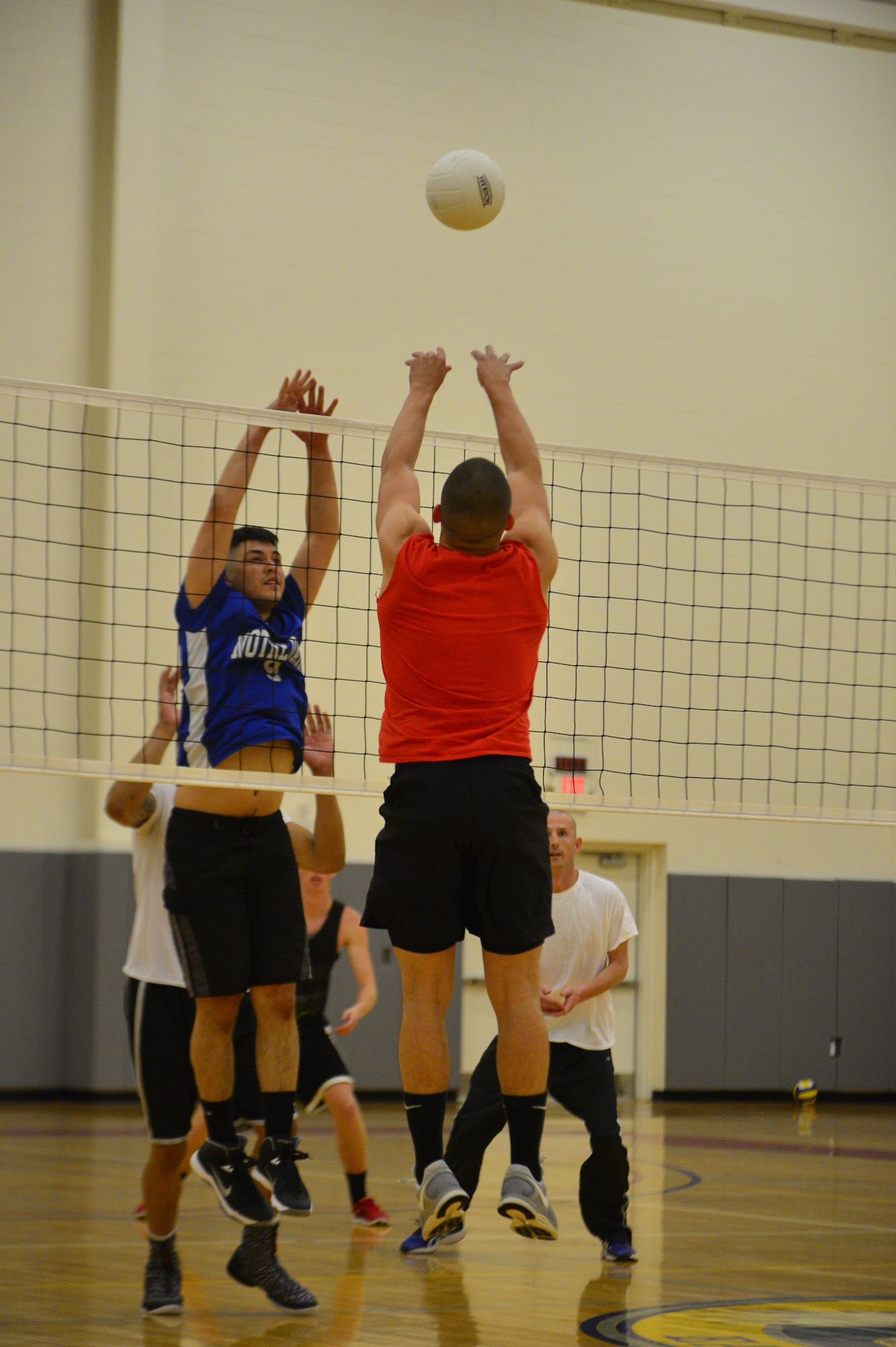 Antonio Chaviano, 436th Logistics Readiness Squadron volleyball team, hits a ball over the net during an intramural volleyball game May 13, 2014, at the fitness center on Dover Air Force Base, Del. With the win, LRS has moved into first place in the American League. (U.S. Air Force photo/Airman 1st Class Zachary Cacicia)