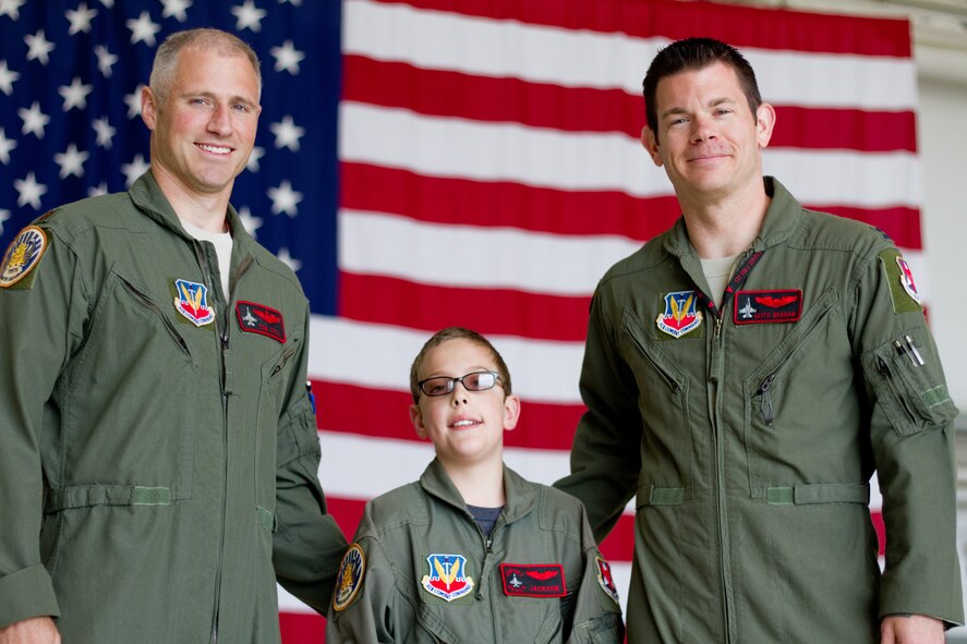 U.S. Air Force Maj. Tom Still, left, and Capt. Keith Graham, right, pose with 9-year-old Jackson Sheppard, at Atlantic City Air National Guard Base, N.J. on May 7, 2014. Sheppard, from Moorestown, N.J.,  suffers from epilepsy and cerebral palsy, and was honored at the 177th as Pilot for a Day.  Still and Graham are both F-16 Fighting Falcon pilots from the New Jersey Air National Guard's 177th Fighter Wing.  (U.S. Air National Guard photo by Tech. Sgt. Matt Hecht/Released)