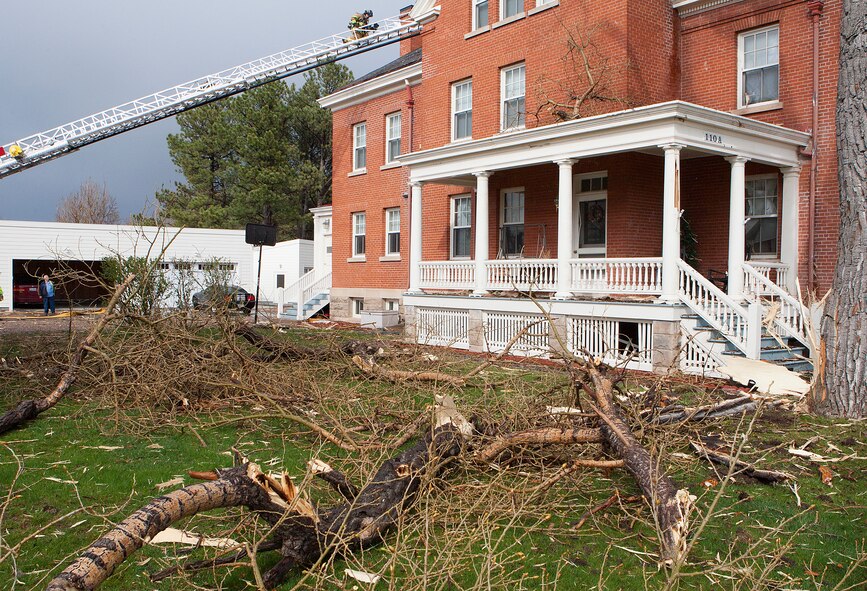 140507-F-JW079-003
Debris and branches litter the yard between Quarters 110 and 108 on Fort Warren Avenue on F.E. Warren Air Force Base May 7, 2013 following a lightning strike. The lightning and the resulting exploded tree damaged four housing units. Repair estimates exceed $50,000. (U.S. Air Force photo by R.J. Oriez)
