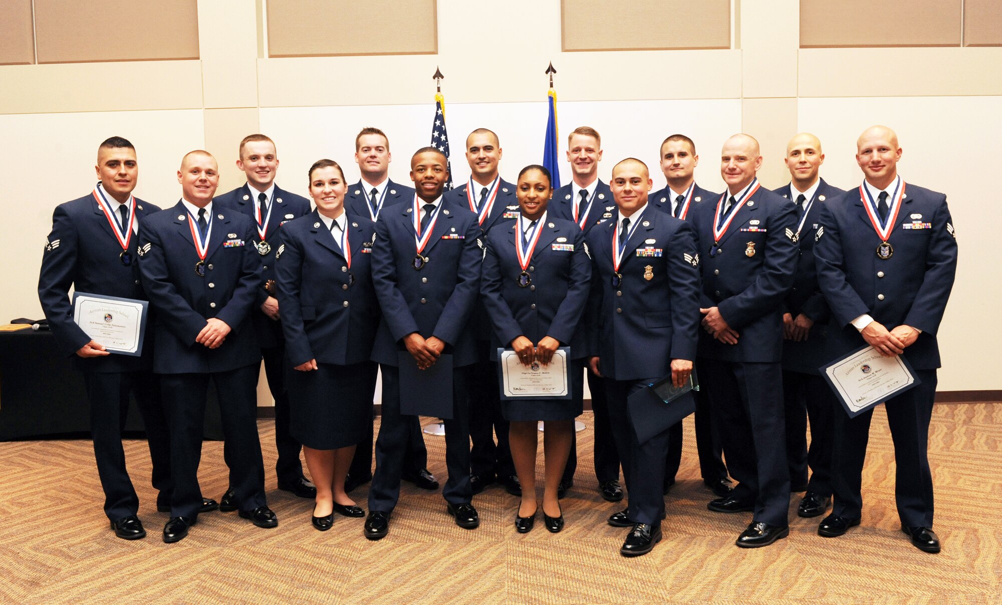Buckley Airman Leadership School Class 14-D stand together after their graduation May 9, 2014, at the Leadership Development Center on Buckley Air Force Base, Colo. This graduation represents an important part of the enlisted force professional military education, teaching valuable skills required for supervisors. (U.S. Air Force photo by Airman Emily E. Amyotte/Released)