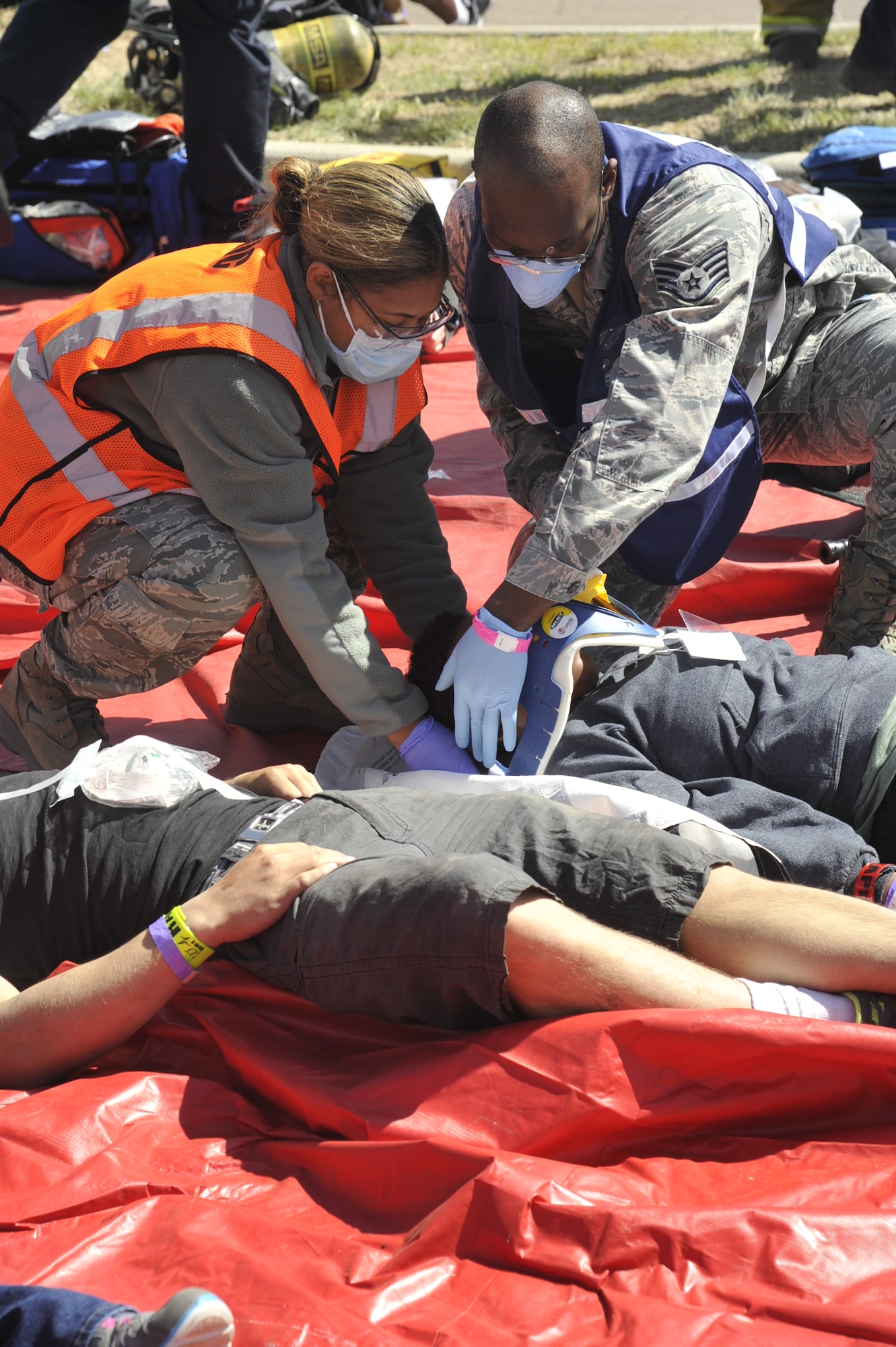 COLORADO SPRINGS, Colo. – Medical personnel from Peterson AFB place a neck brace on an actor simulating wounds sustained during airplane crash near the Colorado Springs Airport. The event was part of a larger emergency response exercise called SkyFall, which consisted of a massive collaboration between multiple agencies throughout the Colorado Springs region. (U.S. Air Force photo/Robb Lingley)