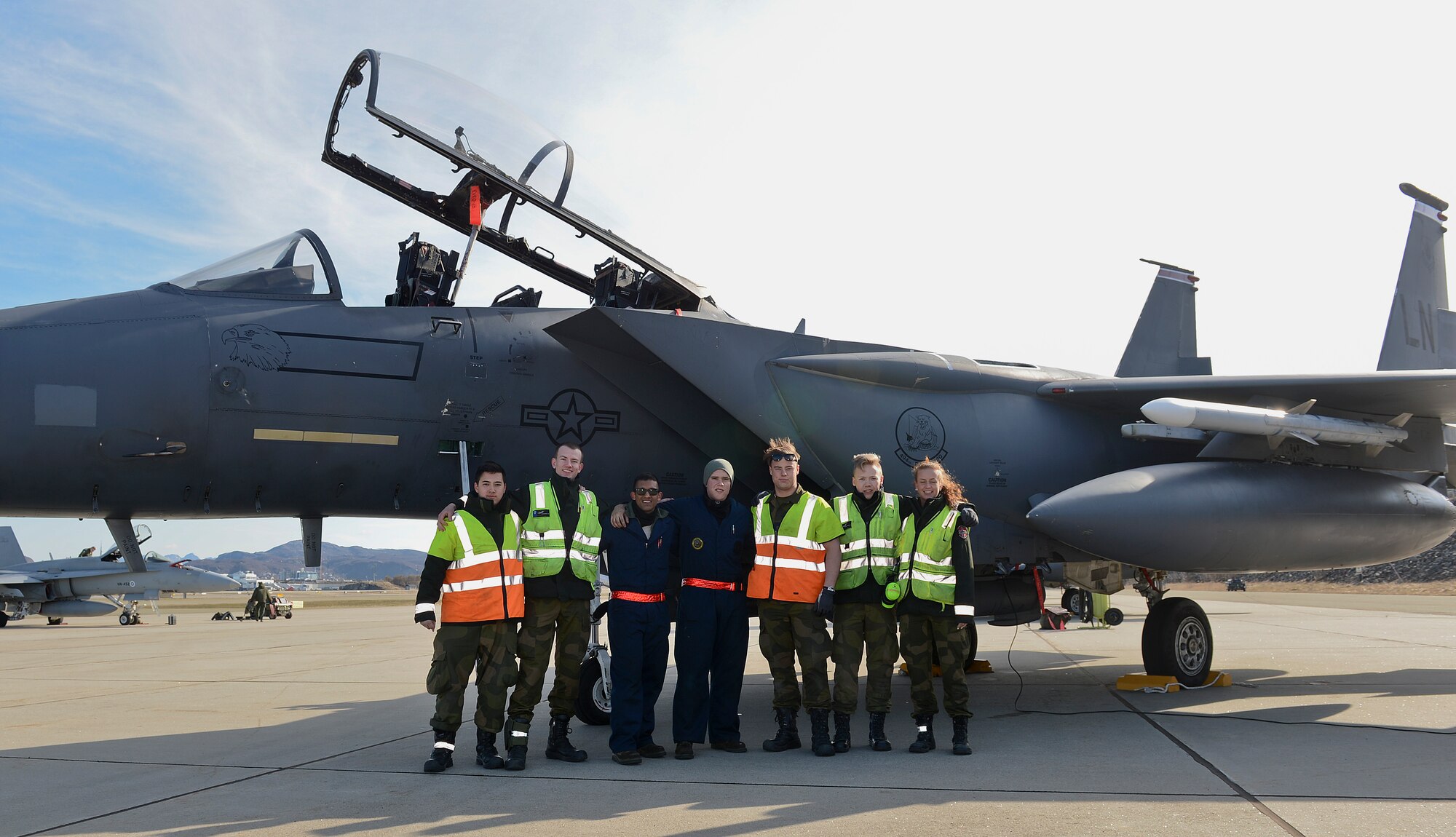 United States and Norwegian air force maintenance personnel pose for a photo in front of a U.S. F-15E Strike Eagle at Bodø Main Air Station, Norway, May 7, 2014. The U.S. Air Force worked side-by-side with European allies and partners at the recent Nordic Defense Cooperation exercise to build relationships with other nations. (U.S. Air Force photo by Airman 1st Class Trevor T. McBride/Released)