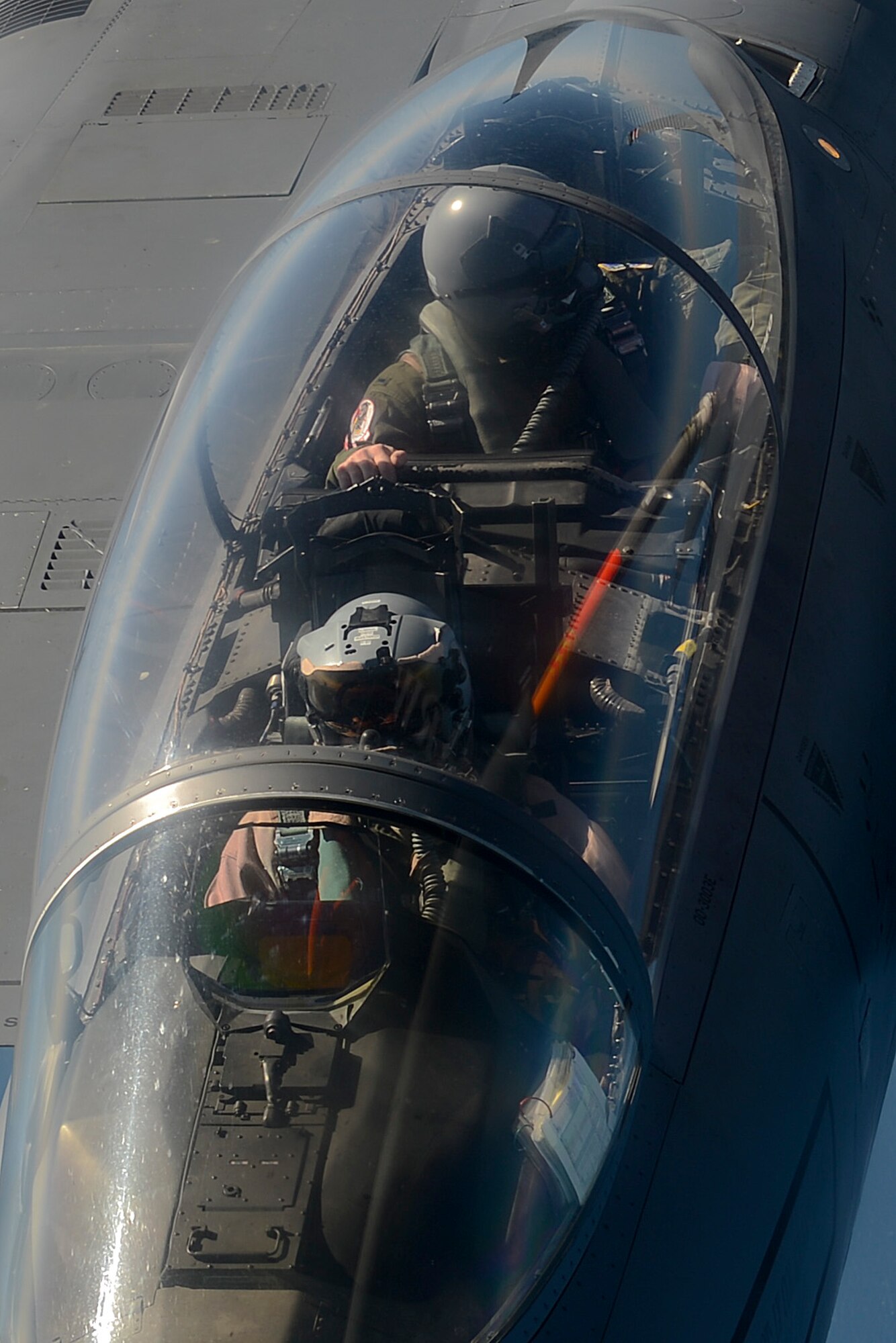 A pilot and a weapon systems officer in a U.S. Air Force F-15E Strike Eagle, assigned to the 48th Fighter Wing, link with a KC-135R Stratotanker for aerial refueling May 6, 2014, en route to a Nordic Defense Cooperation exercise with air forces from Norway, Sweden and Finland. The exercise strengthened the U.S. Air Force’s interoperability with NATO allies and regional through regular combined training. (U.S. Air Force photo by Airman 1st Class Trevor T. McBride/Released)