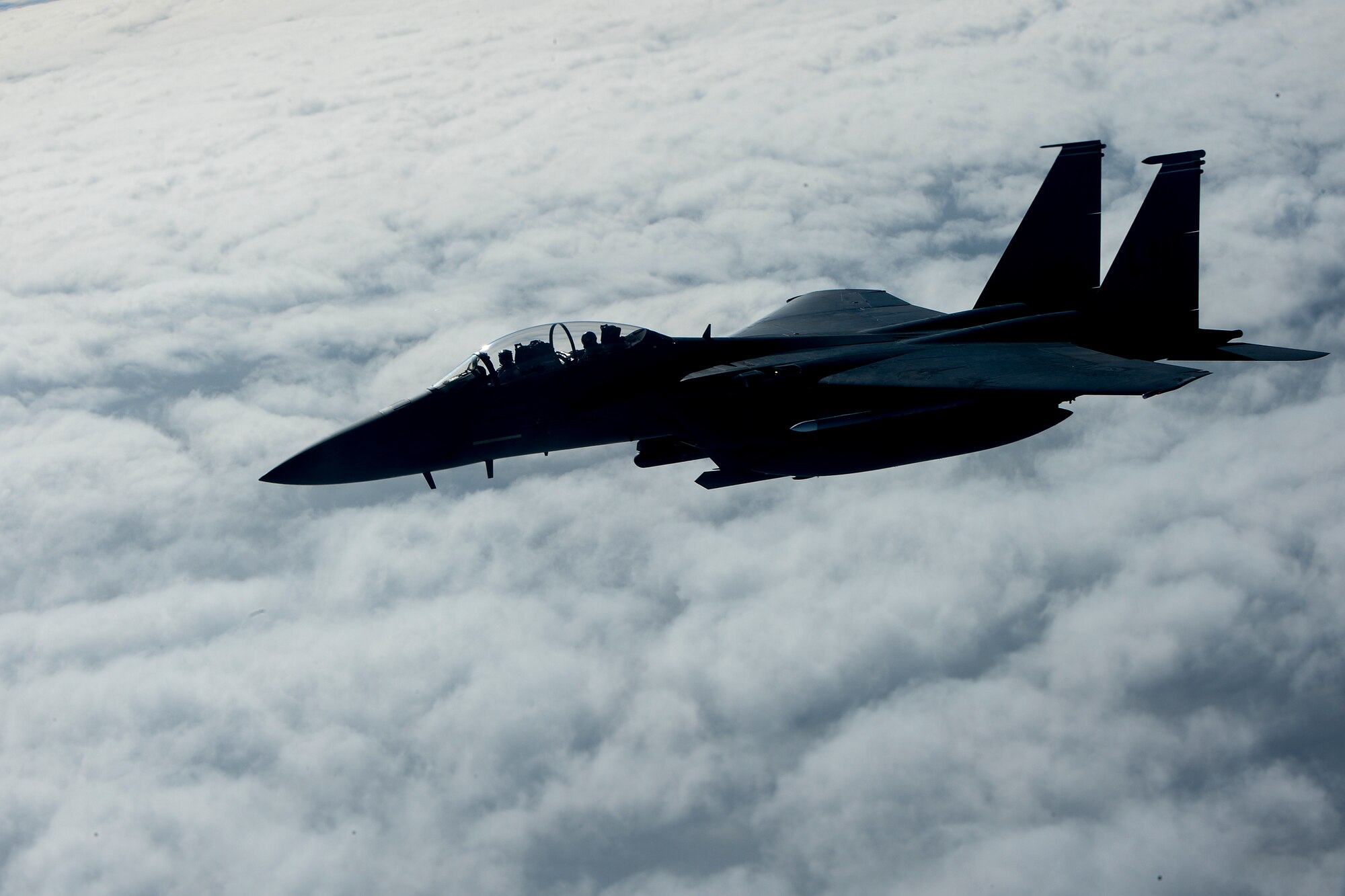An F-15E Strike Eagle, assigned to the 48th Fighter Wing, soars through the early-morning sky en route to Bodo Main Air Station, Norway, May 6, 2014. Airmen from the 48th FW worked with air forces from Norway, Finland and Sweden to strengthen U.S. Air Force interoperability with NATO allies and regional partners through combined training. (U.S. Air Force photo by Airman 1st Class Trevor T. McBride/Released)