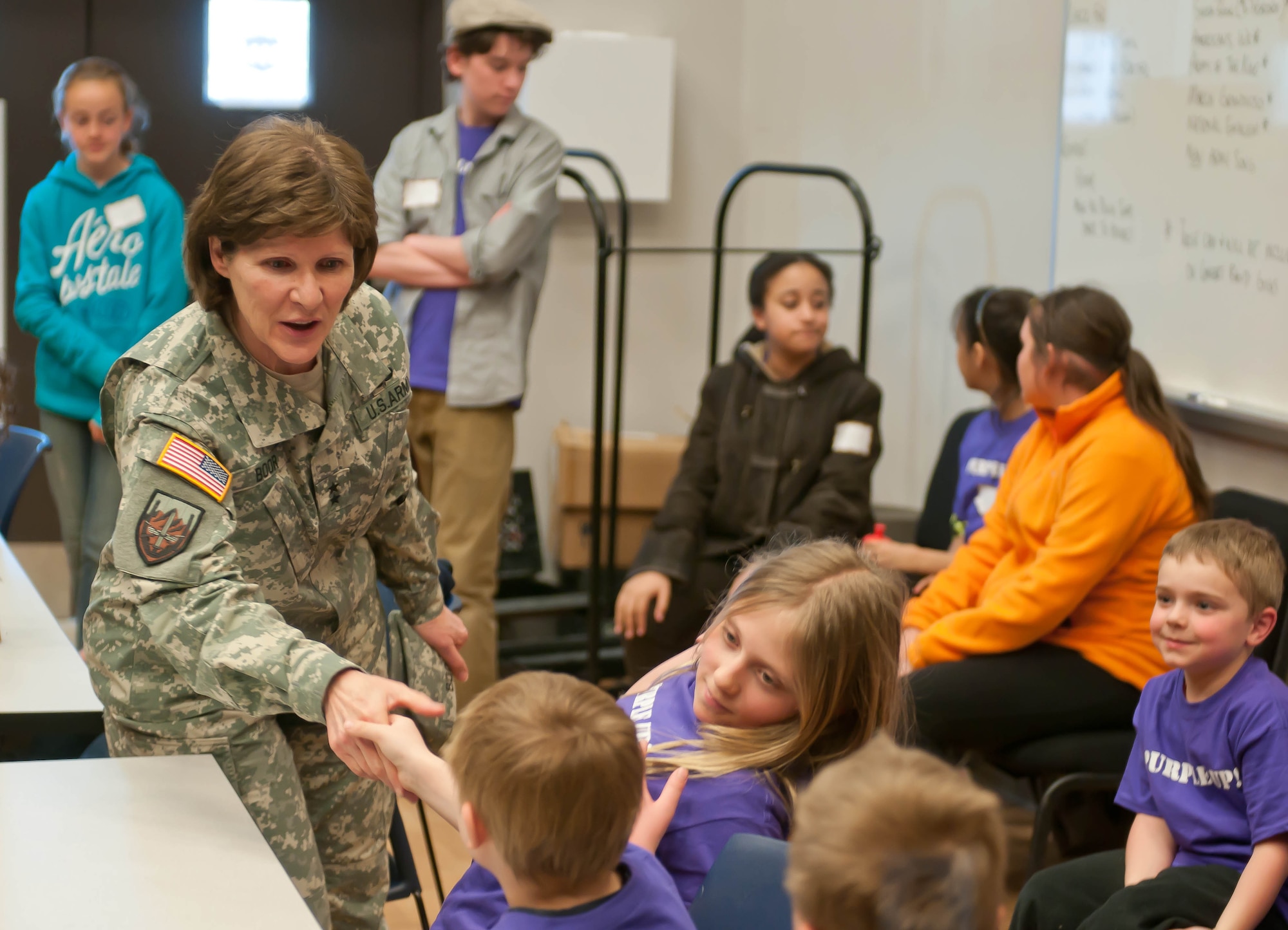 Maj. Gen. Margaret W. Boor, commanding general of the Army Reserve’s 99th Regional Support Command, greets more than 50 children participating in the command’s Bring Your Child to Work Day event April 25 at Joint Base McGuire-Dix-Lakehurst, N.J. The children had a chance to learn about their parents’ occupations, what the 99th RSC and other Army Reserve units do on a daily basis, and what it’s like to serve in the military. (U.S. Army photo by Sgt. 1st Class Raymond Moore/Released)