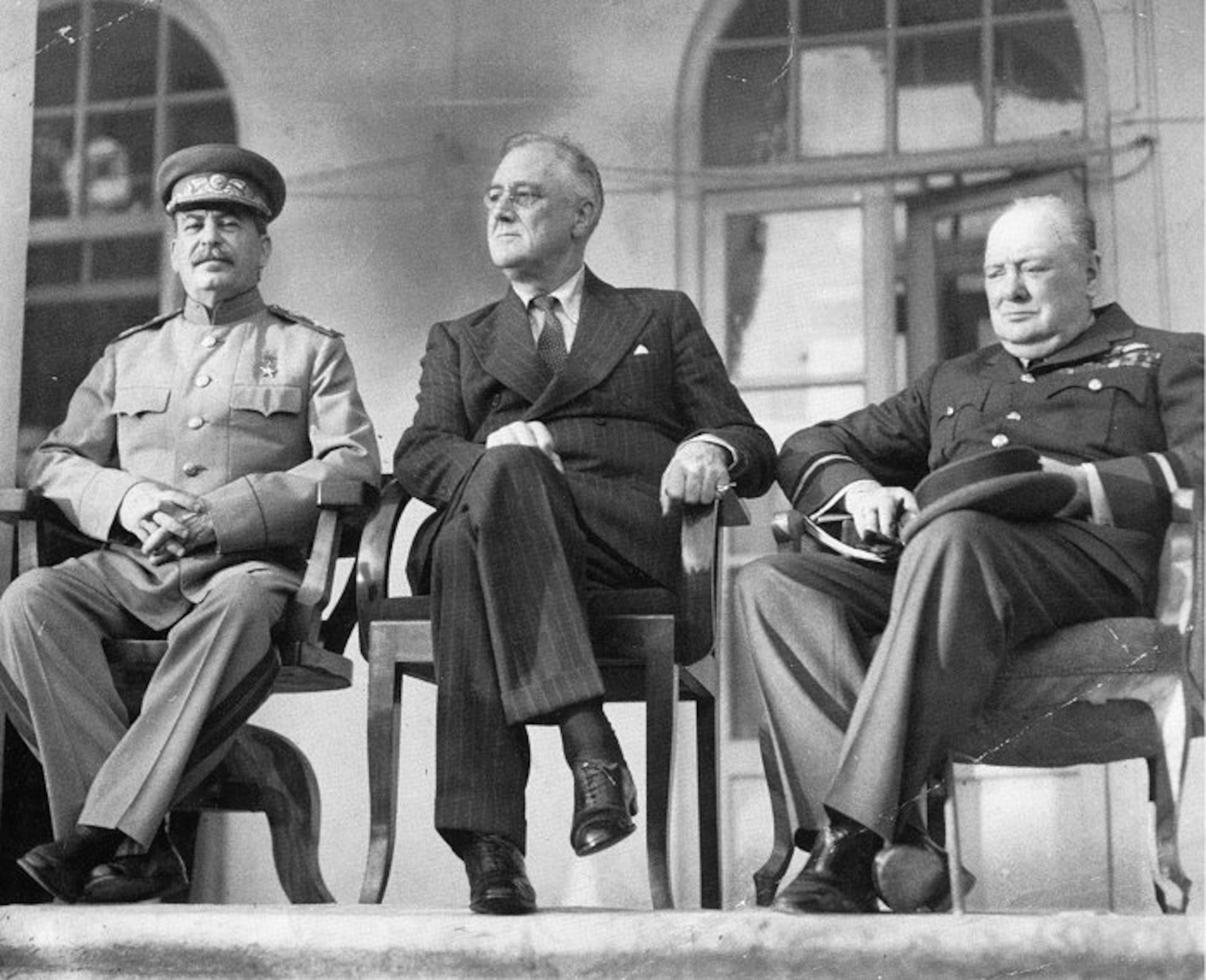 The "Big Three": From left to right: Joseph Stalin, Franklin D. Roosevelt, and Winston Churchill on the portico of the Russian Embassy during the Tehran Conference to discuss the European Theatre in 1943. Churchill is shown in the uniform of a Royal Air Force air commodore.This was the first time Joseph Stalin (L) had met the other two Allied leaders.