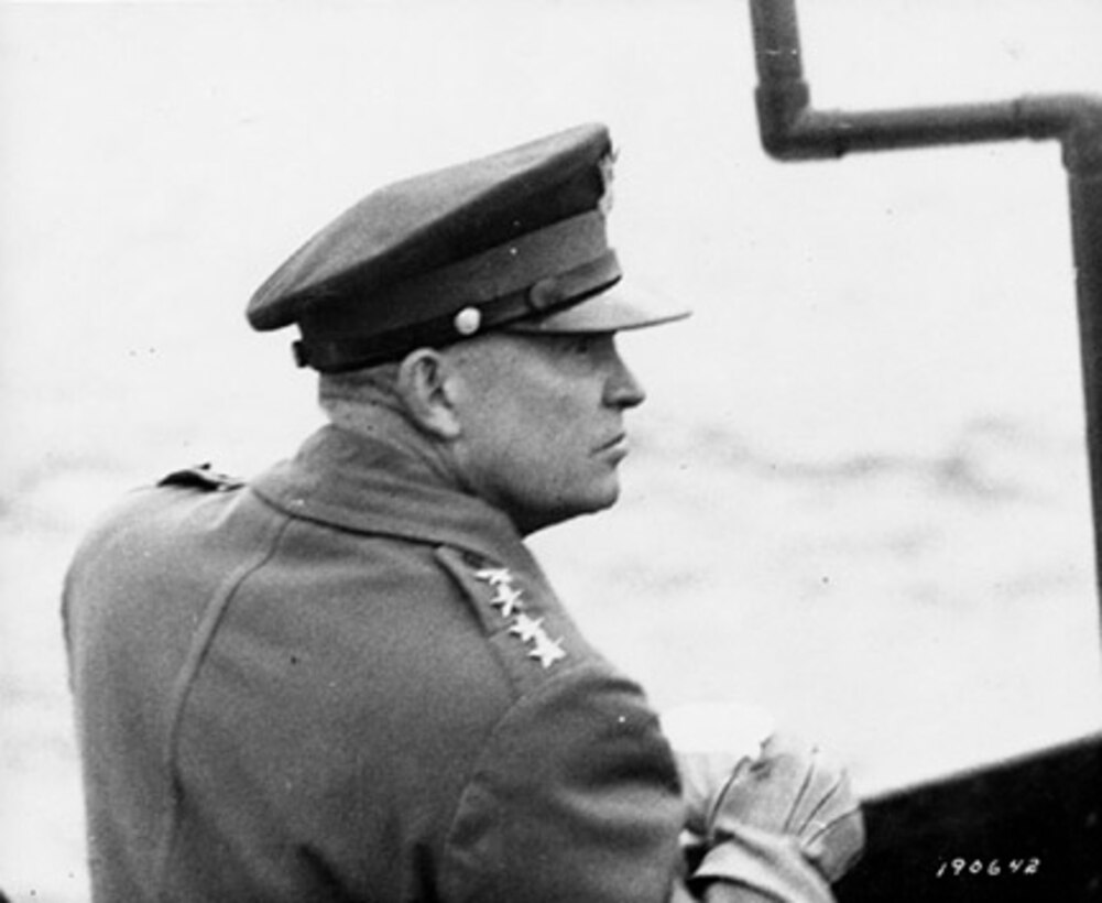 DDE observes air activity from the deck of a warship in the English Channel off the French coast.