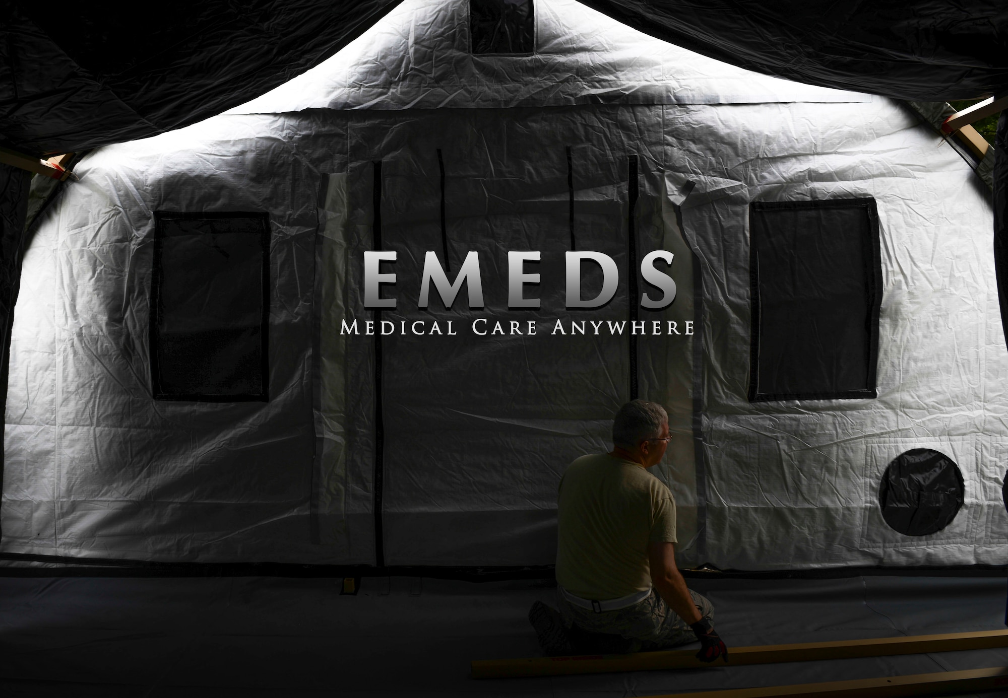 An Expeditionary Medical Support tent is nearing completion during an exercise at Yokota Air Base, Japan, May 14, 2014.  EMEDS tents have a fully functioning pharmacy, laboratory, dental and mental health clinics to treat patients. (U.S. Air Force graphic by Airman 1st Class Meagan Schutter/Released)