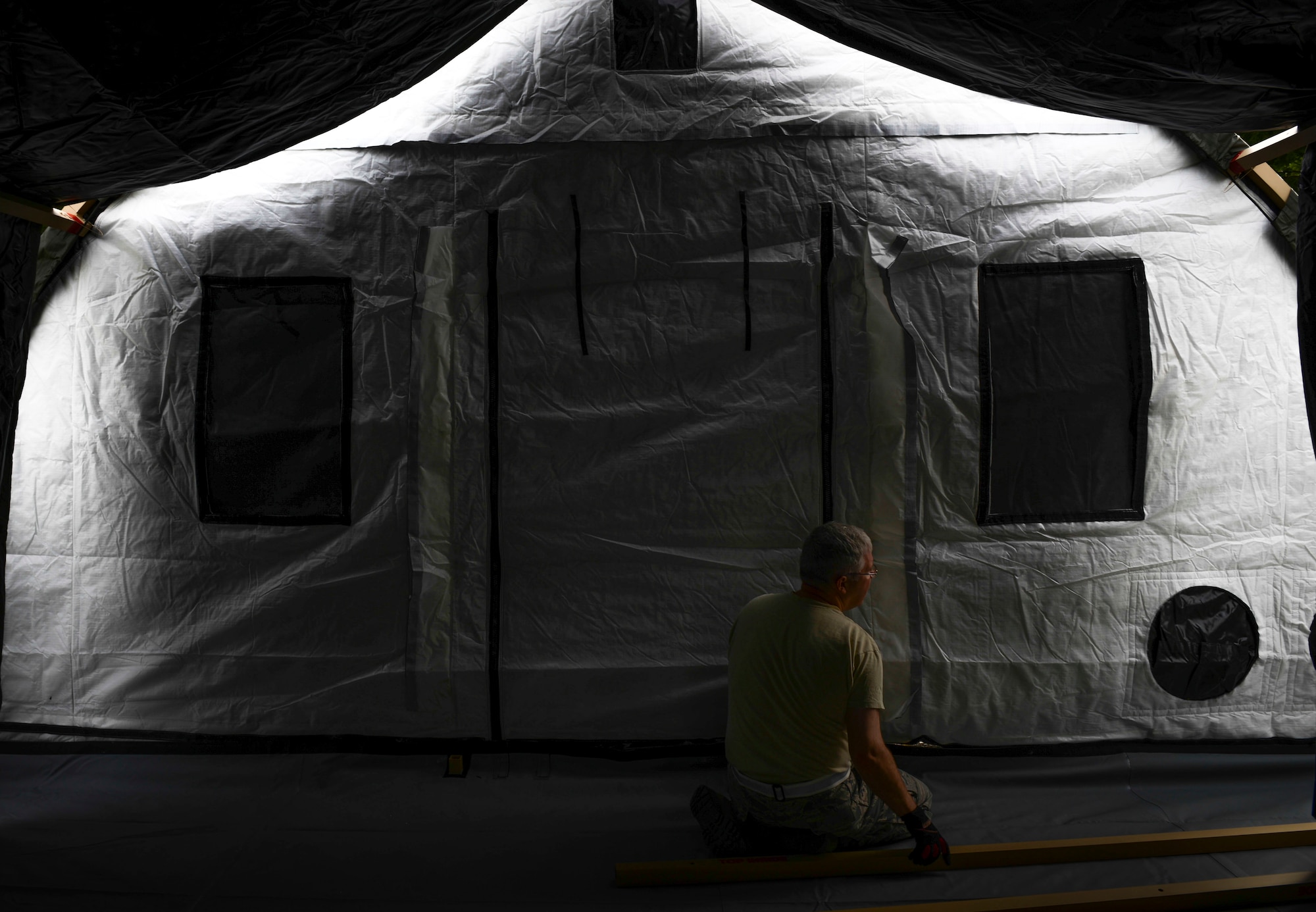 An Expeditionary Medical Support tent is nearing completion during an exercise at Yokota Air Base, Japan, May 14, 2014.  EMEDS tents have a fully functioning pharmacy, laboratory, dental and mental health clinics to treat patients. (U.S. Air Force photo by Airman 1st Class Meagan Schutter/Released)