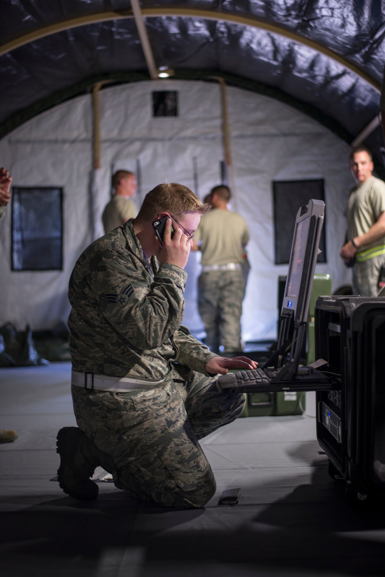 Senior Airman Melvin Ford, 374th Medical Support Squadron information technology technician, works on a deployable Theater Medical Information Program server during a Samurai Readiness Inspection at Yokota Air Base, Japan, May 14, 2014. The MDSS team practiced their Expeditionary Medical Support capability to better prepare themselves for contingency medical responses. (U.S. Air Force Photo by Capt. Raymond Geoffroy)