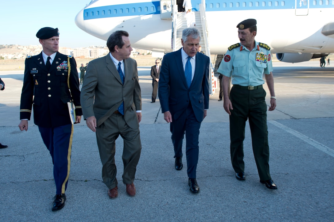 U.S. Defense Secretary Chuck Hagel, second from right, walks with Jordanian Chairman of the Joint Chiefs of Staff Lt. Gen. Mashal Mohammad Al-Zaben, Stuart E. Jones, U.S. ambassador to Jordan, and U.S. Defense Attache Army Col. Robert Paddock to a meeting with defense counterparts in Amman, Jordan, May 14, 2014. Hagel discussed issues of mutual importance during the meeting.
