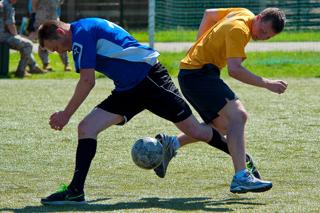 U.S. Navy Petty 3rd Class Matthew Kelley competes against the Latvian navy soccer team during an annual tournament in Ventspils, Latvia, June 9, 2013. The multinational exercise is designed to enhance maritime capabilities and interoperability with partner nations to promote maritime safety and security in the Baltic Sea. Kelley is assigned to the amphibious command ship USS Mount Whitney.