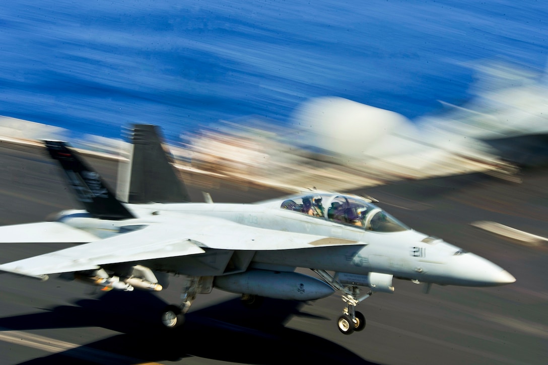 An F/A-18F Super Hornet performs an arrested recovery on the flight deck of the aircraft carrier USS Dwight D. Eisenhower in the North Arabian Sea, May 22, 2013. The Eisenhower is deployed to the U.S. 5th Fleet area of responsibility promoting maritime security operations, theater security cooperation efforts and support missions as part of Operation Enduring Freedom. The Hornet is assigned to Strike Fighter Squadron 103.  
