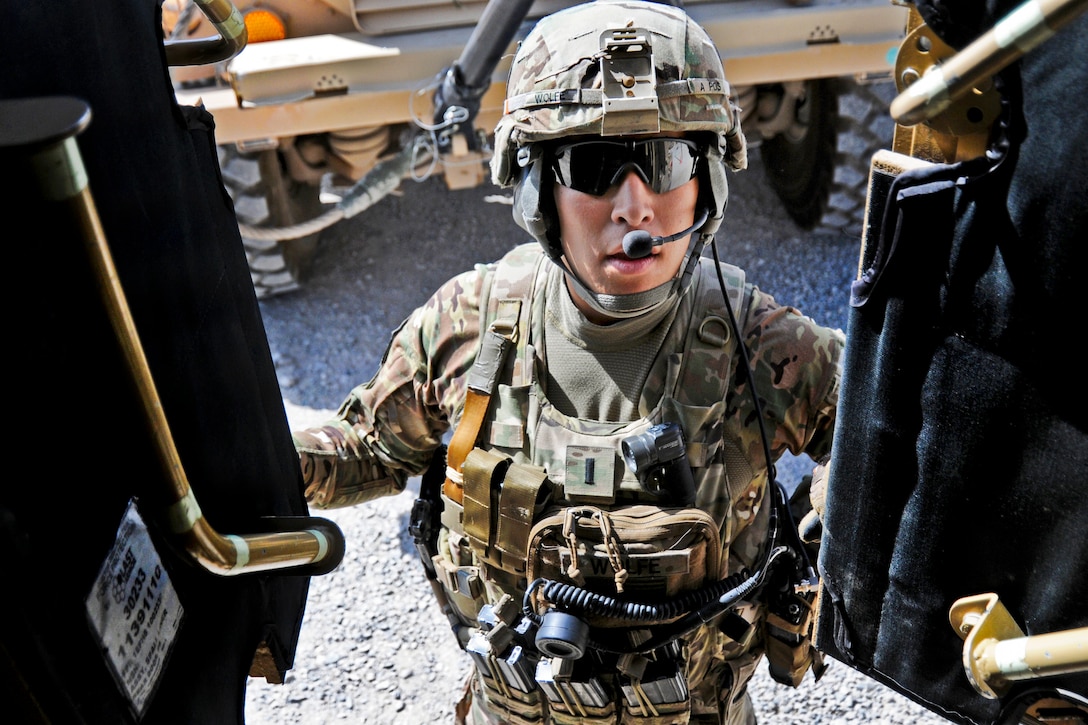 U.S. Army 1st Lt. Robert Wolfe closes the doors of a tactical vehicle before departing Forward Operating Base Farah for a mission in Farah CIty, Afghanistan, May 22, 2013. Wolfe, a platoon leader, is assigned to Provincial Reconstruction Team Farah. 
