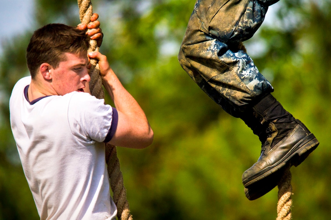 Midshipmen from the U.S. Naval Academy Class of 2016 navigate an obstacle course during the U.S. Naval Academy’s sea trials in Annapolis, Md., May 14, 2013.  
