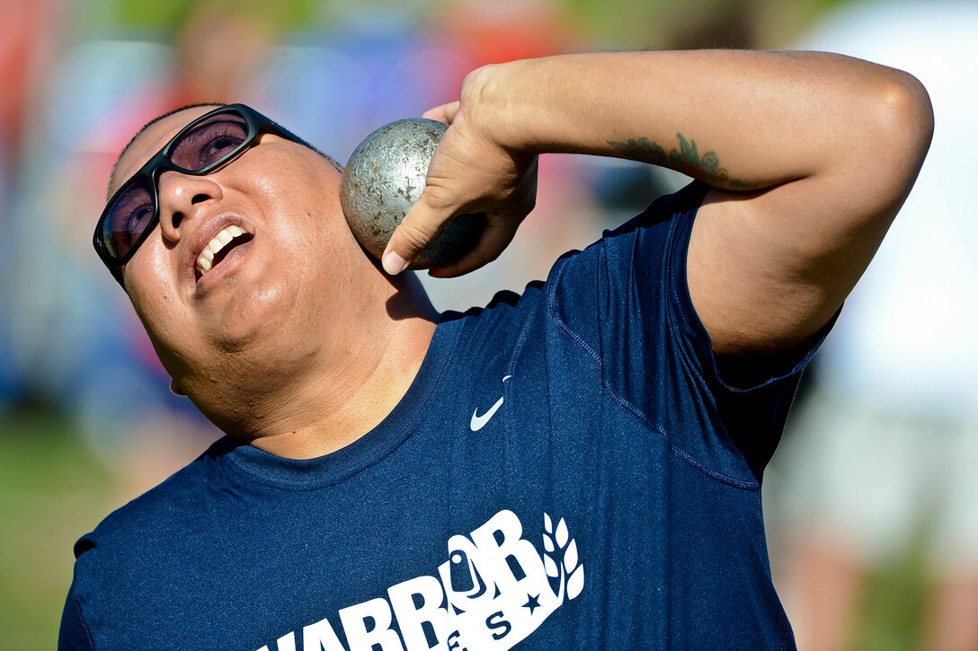 Navy Petty Officer 1st Class Jim Castaneda throws the shot put during the 2013 Warrior Games in Colorado Springs, Colo., May 14, 2013. More than 200 wounded, ill, and injured service members and veterans will compete in the games.  
