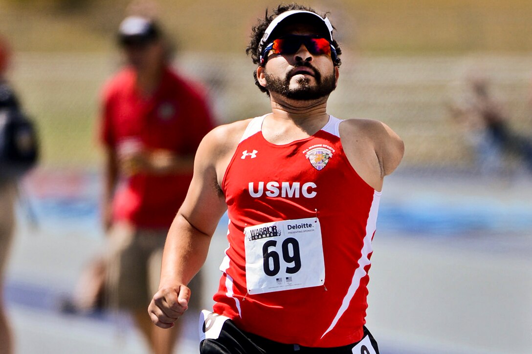 Marine Corps veteran Cpl. Manual Jimenez wins the men's 1500 upper body amps and limb disjunction race during the 2013 Warrior Games track and field competition in Colorado Springs, Colo., May 14, 2013. More than 200 wounded, ill, and injured service members and veterans will compete in the games, which run through May 16. The military service with the most medals will win the Chairman's Cup.  
