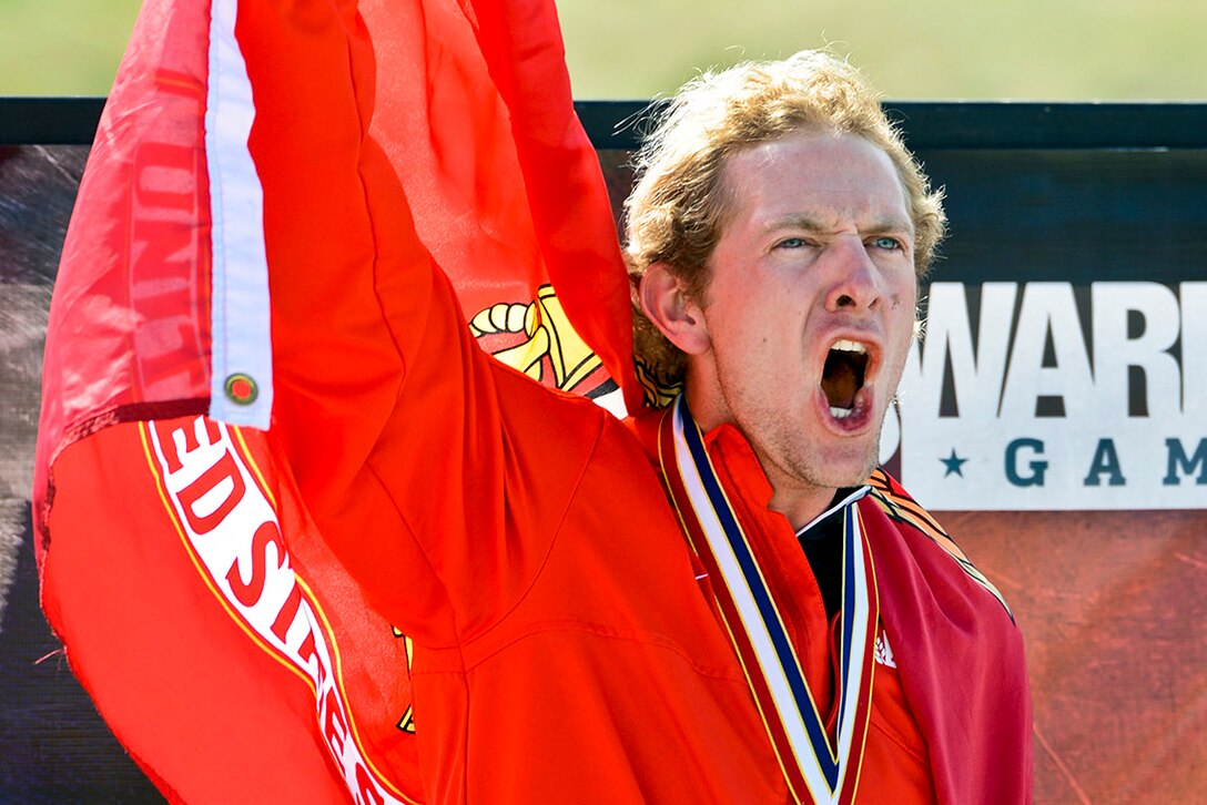 Marine Corps Sgt. Brian McPherson reacts to winning gold in the Men's Bicyle Open event of the 2013 Warrior Games in Colorado Springs, Colo., May 12, 2013. More than 200 wounded, ill, and injured service members and veterans will compete in the games, which run through May 16.  
