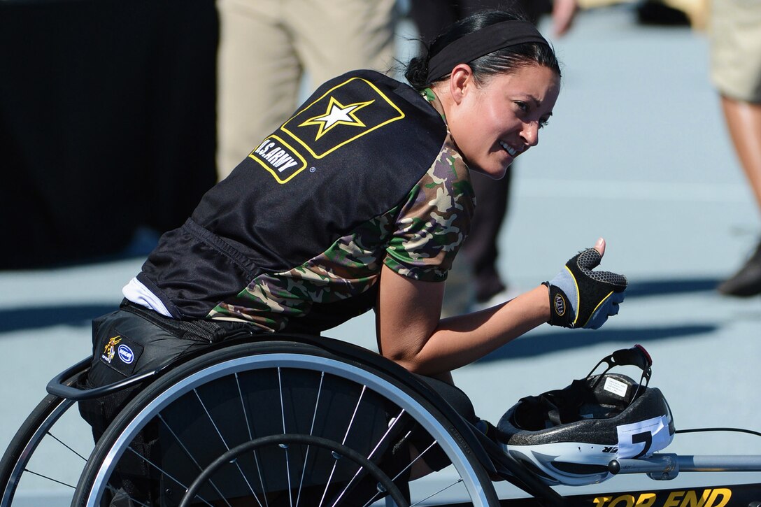 Army Spc. Elizabeth Wasil wins gold in the 1500-meter wheelchair race during the 2013 Warrior Games in Colorado Springs, Colo., May 14, 2013. More than 200 wounded, ill, and injured service members and veterans will compete in the games, which run through May 16. The military service with the most medals will win the Chairman's Cup.  
