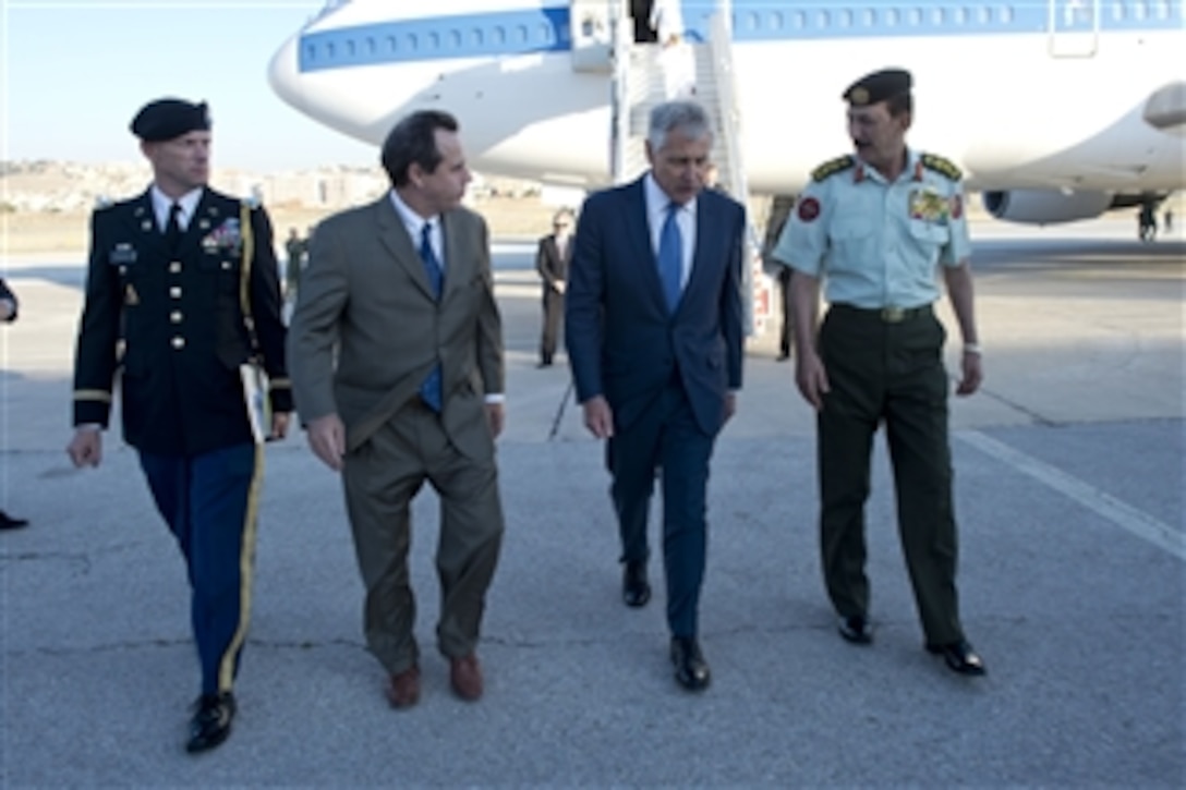 U.S. Defense Secretary Chuck Hagel, second from right, walks with Jordanian Chairman of the Joint Chiefs of Staff Lt. Gen. Mashal Mohammad Al-Zaben, Stuart E. Jones, U.S. ambassador to Jordan, and U.S. Defense Attache Army Col. Robert Paddock to a meeting with defense counterparts in Amman, Jordan, May 14, 2014. Hagel discussed issues of mutual importance during the meeting.