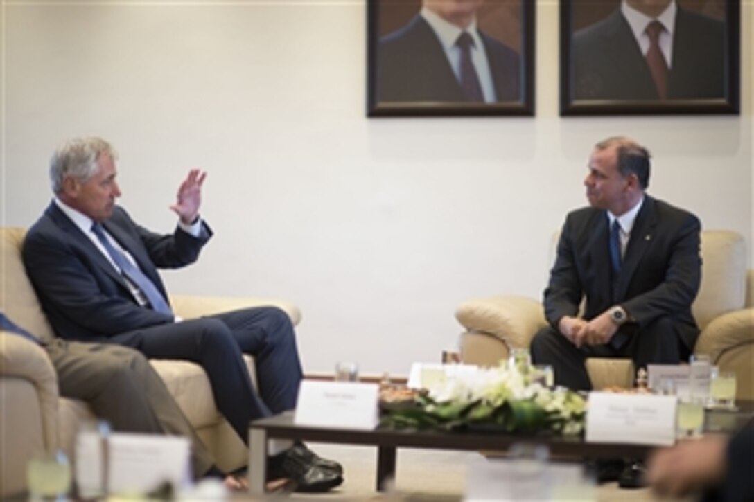 U.S. Defense Secretary Chuck Hagel, left, meets with Jordanian Prince Faisal bin Al Hussein in Amman, Jordan, May 14, 2014. The two leaders met to discuss issues of mutual importance. 