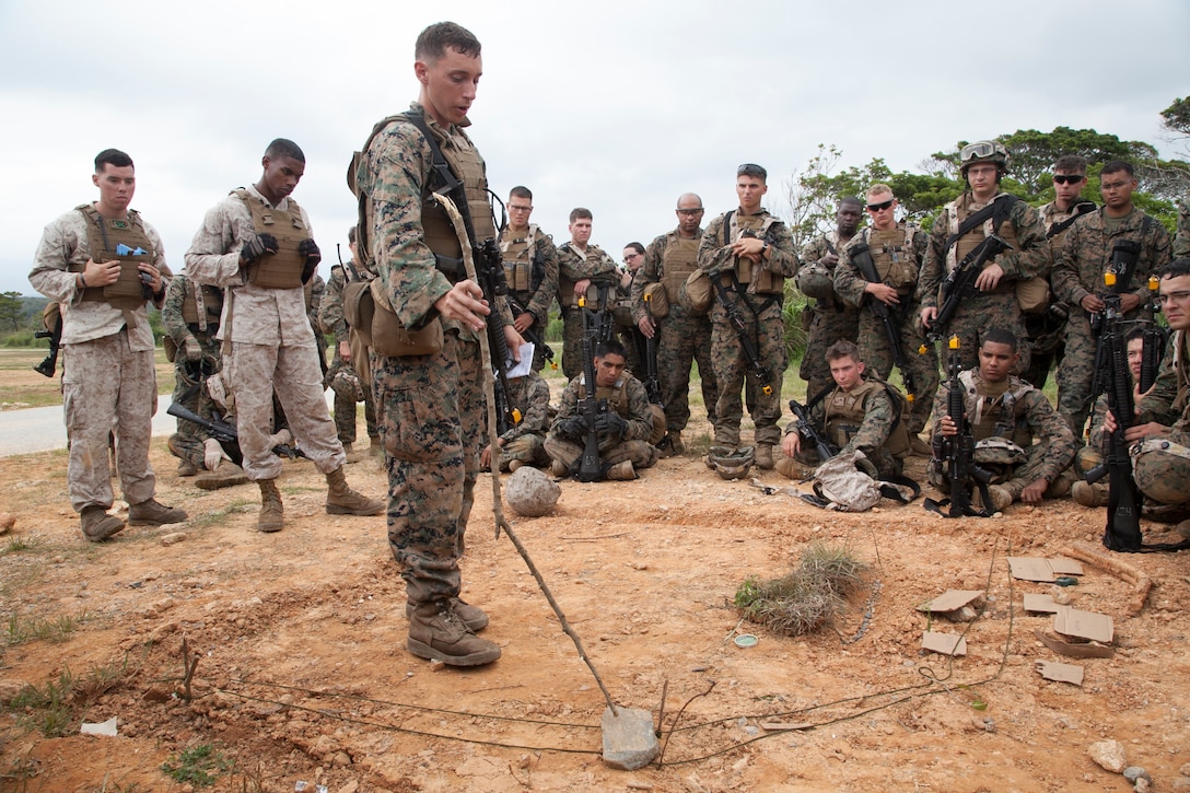 Cpl. Jared M. Cantu uses a terrain model to brief his plan of attack during military operations on urbanized terrain training May 7 at Combat Town in the Central Training Area. After each attempt to capture and occupy Combat Town, the Marines received constructive criticism about areas where they could improve and then prepared to attack again. Cantu, a San Antonio, Texas, native, is an engineer equipment electrical systems technician with Combat Logistics Battalion 4, Combat Logistics Regiment 3, 3rd Marine Logistics Group, III Marine Expeditionary Force.