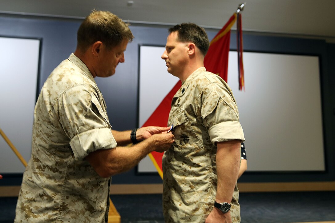Major Gen. Mark A. Clark, commander U.S. Marine Corps Forces Special Operations Command, decorates Master Sgt. Donovan Petty, a critical skills operator with 2nd Marine Special Operations Battalion, with the Silver Star Medal following at the MARSOC headquarters, May 12, 2014. Petty's team was engaged by insurgent personnel in Afghanistan when his actions led to the successful capture of a key insurgent leader. “This award isn’t about me; it’s about my team and their collective actions on that day. They should be receiving an award, not me,” said Petty. (U.S. Marine Corps photo by Lance Cpl. Ryan A. Young)