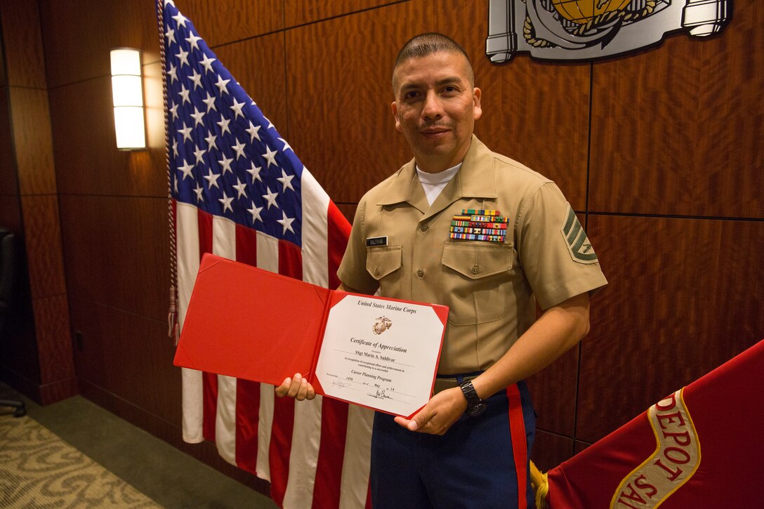 Staff Sgt. Mario A. Saldivar, 12th Marine Corps District career planner, received a certificate of appreciation from Brig. Gen. James. W. Bierman, commanding general of Marine Corps Recruit Depot (MCRD) San Diego and Western Recruiting Region, aboard MCRD San Diego, May 14, 2014.  Saldivar was presented the certificate of appreciation for his exceptional effort and achievement in contributing to the career planning program.