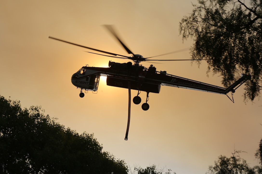 The Tomahawk fire that started on Naval Weapons Station Fallbrook has burned approximately 6,000 acres and has moved onto Camp Pendleton.

Camp Pendleton personnel in the 14-Area have been ordered to shelter in place.

Naval Weapons Station Fallbrook personnel, Camp Pendleton's De Luz housing residents and Mary Fay Elementary School were ordered to evacuate at 10:20 today.

Camp Pendleton's O'Neill Heights Housing, as well as the De Luz Child Development Center was also ordered to evacuate at 12:30. 

Camp Pendleton's Paige Field house, located aboard Mainside, is serving as the evacuation site.

Children evacuated from the De Luz Child Development Center have been relocated to the Fisher Child Care Center on Mainside.  Parents can contact the Fisher Child Care Center at (760) 725-0845.

Base fire crews responded to a brush fire aboard Naval Weapons Station, Fallbrook, at approximately 9:45 a.m., today.  Camp Pendleton Fire Department is working with Cal Fire, North County Fire, Orange County Fire, and Oceanside Fire to contain the Tomahawk fire on Naval Weapons Station Fallbrook. 

The cause of the fire is under investigation. 

