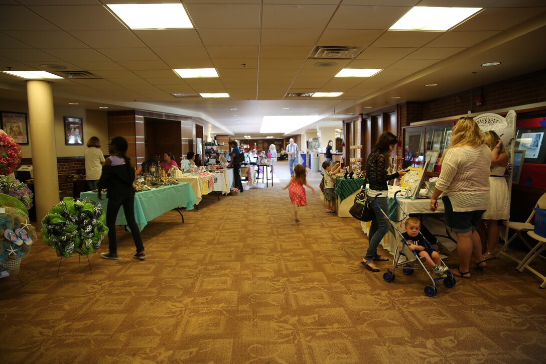 Spouses with the Officers’ Spouses’ Club assisted in hosting the local Craft Show and Yard Sale at the Two Rivers Theater May 10 at Cherry Point. More than 10 craft vendors displayed their creations, which ranged from flags and jewelry to food and baby clothes. This event marked the second year the craft show has been at MCAS Cherry Point.  All proceeds for the event will be used as funding support for local businesses and scholarships for military dependents.
 
