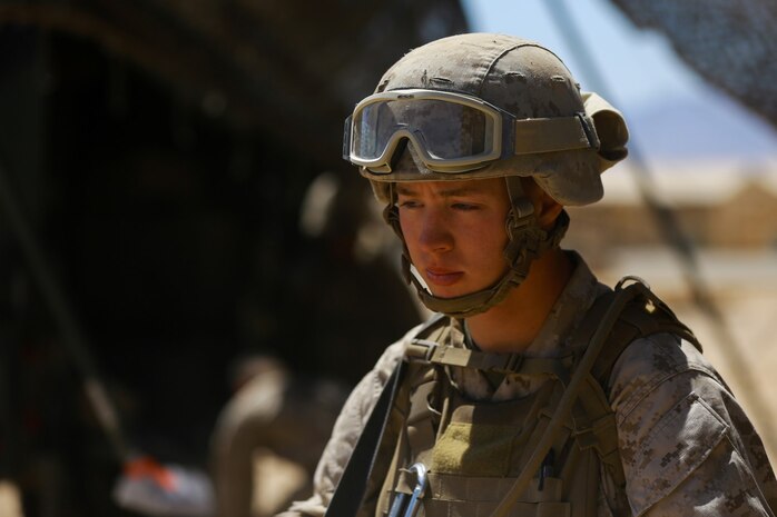 Lance Cpl. Matthew Winans, a data wire technician with Combat Logistics Regiment 1, attends a brief before conducting a security patrol during Exercise Desert Scimitar at Marine Corps Air Ground Combat Center Twentynine Palms, Calif., May 12, 2014. It is not uncommon for Marines like Winans, a native of Chicago, to be called upon to maintain security during field training. 1st Marine Division acts as the headquarters element of I Marine Expeditionary Force during the exercise.