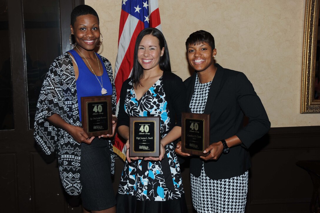 From left, Sgt. Stephanie Bowens, noncommissioned officer-in-charge, Official Mailroom, Marine Corps Logistics Base Albany; Staff Sgt. Juana Snell, equal opportunity advisor, Marine Corps Logistics Command; and Cpl. Candice Clark, operations noncommissioned officer, Support Operations Branch, Marine Corps Systems Command; pose together with their 40 under 40 awards following the May 1 ceremony held at Stonebridge Golf and Country Club in Albany, Ga. The Albany Herald and the Albany Area Chamber of Commerce in partnership with Emerge Albany, the young professionals division of the Chamber, recognized some of Southwest Georgia’s best and brightest during the annual ceremony.