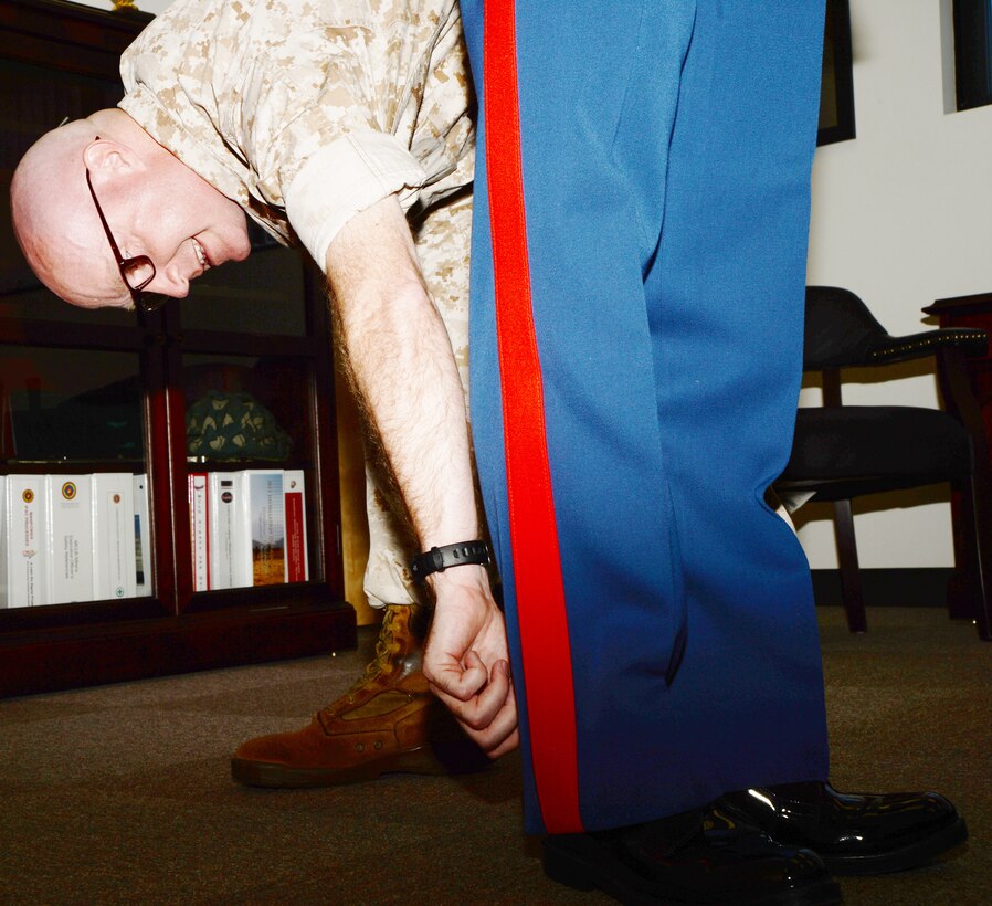 Lt. Col. Daniel Bates, executive officer, Marine Corps Logistics Base Albany, inspects the trousers of Capt. Marc Blair, deputy operations officer, MCLB Albany, as part of the inspector general program inspection, May 9.