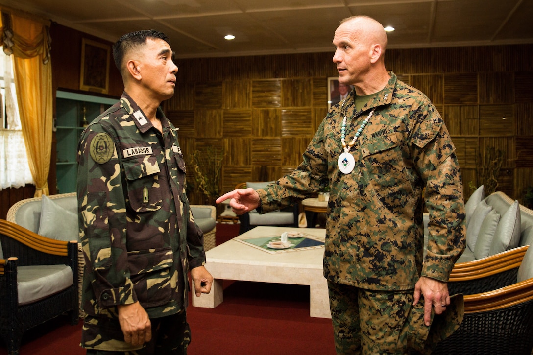 Philippine Brig. Gen. Romeo Labador, deputy commander for operations in Central Command, and Maj. Gen. Richard B. Simcock II, deputy commander of U.S. Marines Corps Forces, Pacific, conduct an office call at Camp Lapu Lapu, Cebu, Philippines, May 13, 2014. The two generals were here to speak at the Urban Search and Rescue training closing ceremony, which focused on techniques needed for USAR missions that arise from natural disasters. The training evolution, as part of Balikatan 2014, aimed at enhancing interoperability and strengthening the Philippine-U.S. relationship.