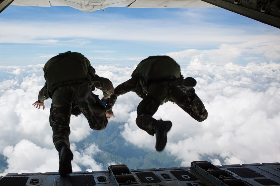 Philippine Army Special Forces freefall jumpers with Special Operations Command, stationed at Fort Magsaysay jump from a KC-130J "Sumos", assigned to Marine Aerial Refueler Transport Squadron 152, Marine Aircraft Group 36, 1st Marine Aircraft Wing, based at Marine Corps Air Station Futenma, Okinawa, Japan, during High Altitude Low Opening military freefall jumps during Balikatan 2014 at Fort Magsaysay, Republic of the Philippines, May 14, 2014. This year marks the 30th iteration of Balikatan, which is an annual Republic of the Philippines-U.S. military bilateral training exercise. 
