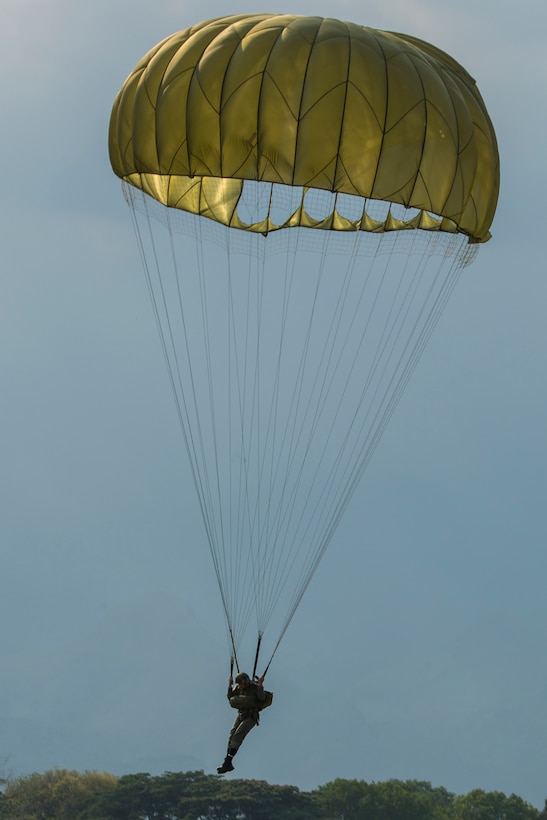 A Philippine Marine prepares to land during static line jumps and High Altitude Low Opening military freefall jumps during Balikatan 2014 at Basa Air Base, Floridablanca, Republic of the Philippines, May 14, 2014. This year marks the 30th iteration of Balikatan, which is an annual Republic of the Philippines-U.S. military bilateral training exercise. 