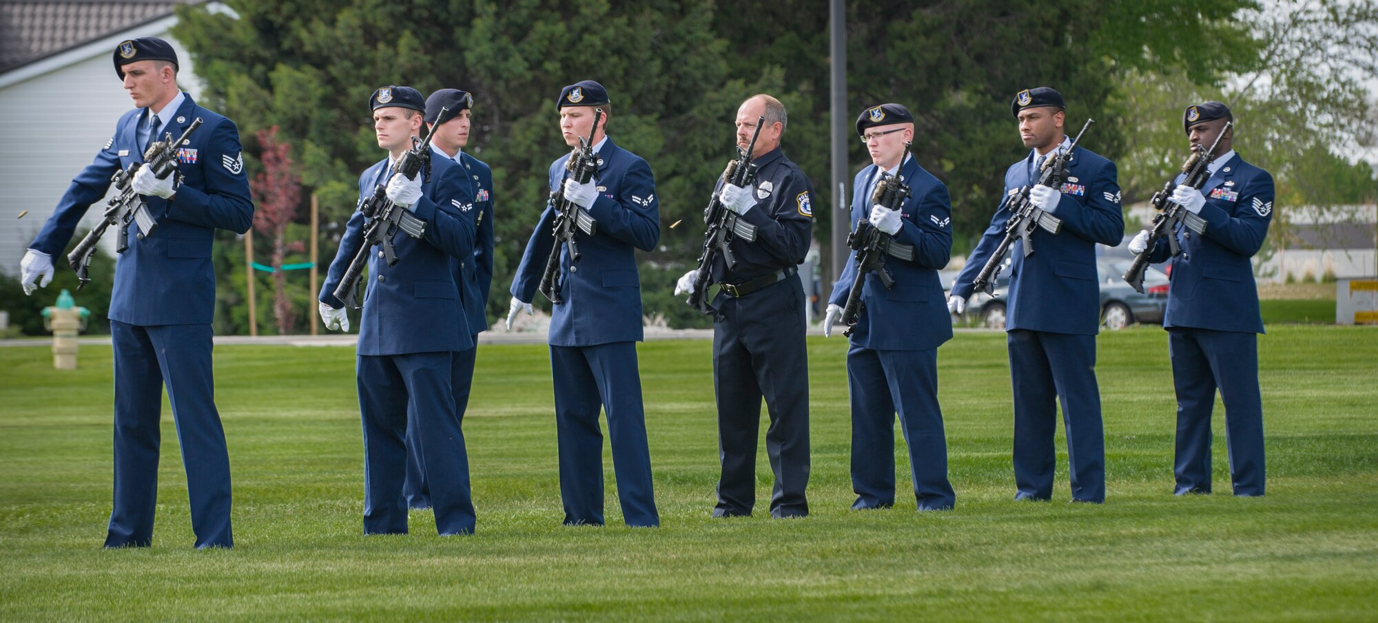 Law enforcement officers, both military and civilian, fire rifles during a Peace Officers Memorial Day retreat ceremony at Mountain Home Air Force Base, Idaho, May 15, 2014. President John F. Kennedy designated May 15th as Peace Officers Memorial Day and the week in which it falls as National Police Week. Mountain Home AFB defenders hosted several events to commemorate National Police Week to honor fallen law enforcement officers. (U.S. Air Force photo by Staff Sgt. Roy Lynch III/RELEASED)