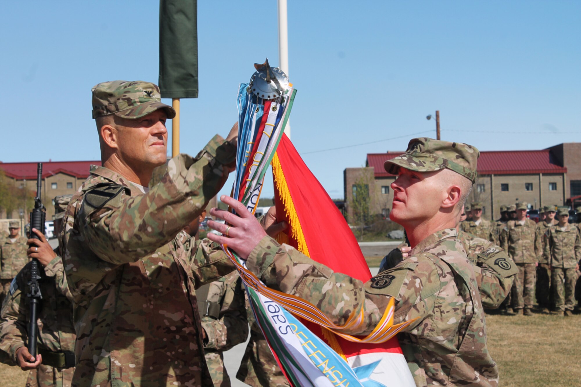 Army Col. Peter Andrysiak, 2d Engineer Brigade commander, and Command Sgt. Maj. Bradley Houston, 2d Engineer Brigade command sergeant major, case the brigade colors May 8 at Pershing Field. (Courtesy photo)