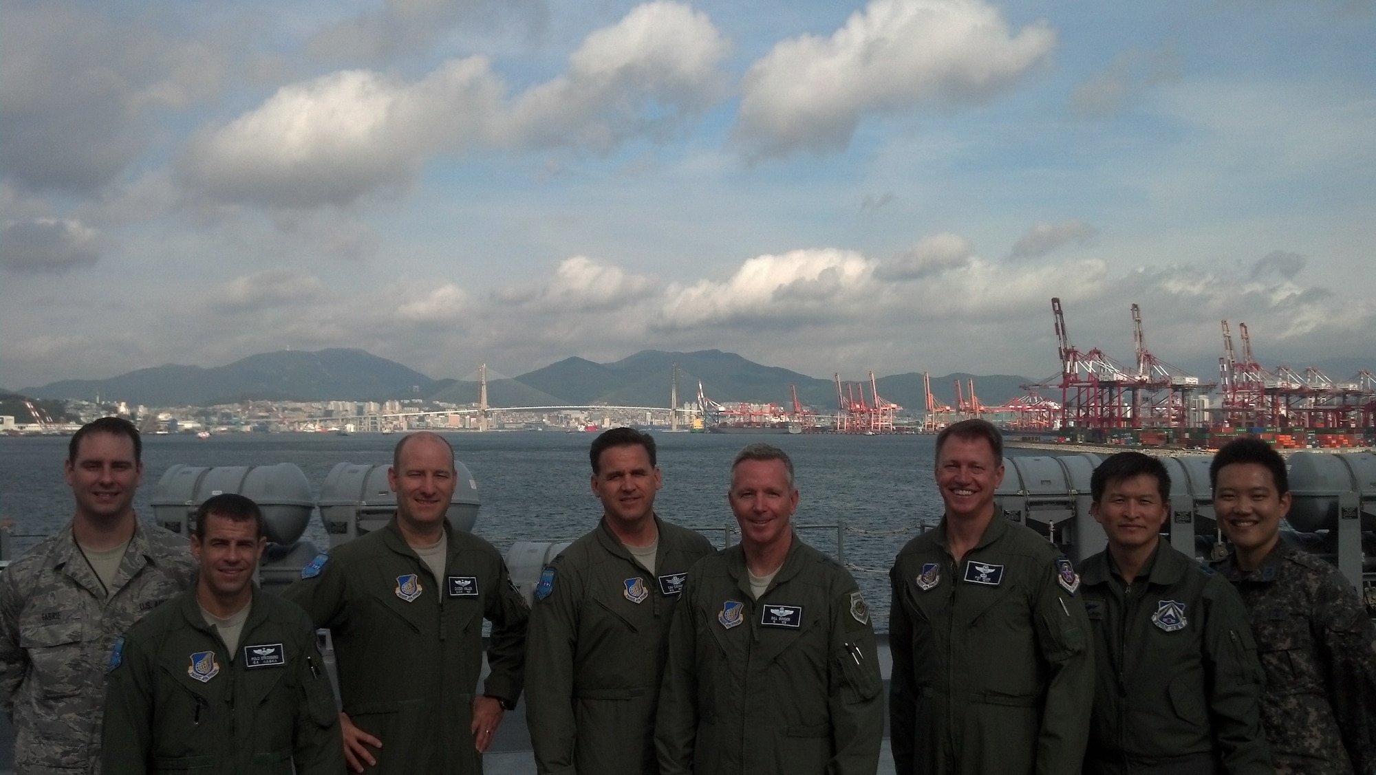Seventh Air Force Joint Air Component Coordination Element gathers on the deck of the USS Blue Ridge, Aug. 29, at the close of ULCHI FREEDOM GUARDIAN 2013. The JACCE team included Air Force reservists along with two members of the Republic of Korea air force. Pictured left to right: Tech. Sgt. Joe Fabrie, Maj. Shad Stromberg, Maj. Mathew Miller, Col. Kevin Cavanagh, Maj. Gen William Binger, Col.Pat Wade, Lt. Col. Gernsu Shin and 1st Lt. San-yik Jeong. (Courtesy photo) 