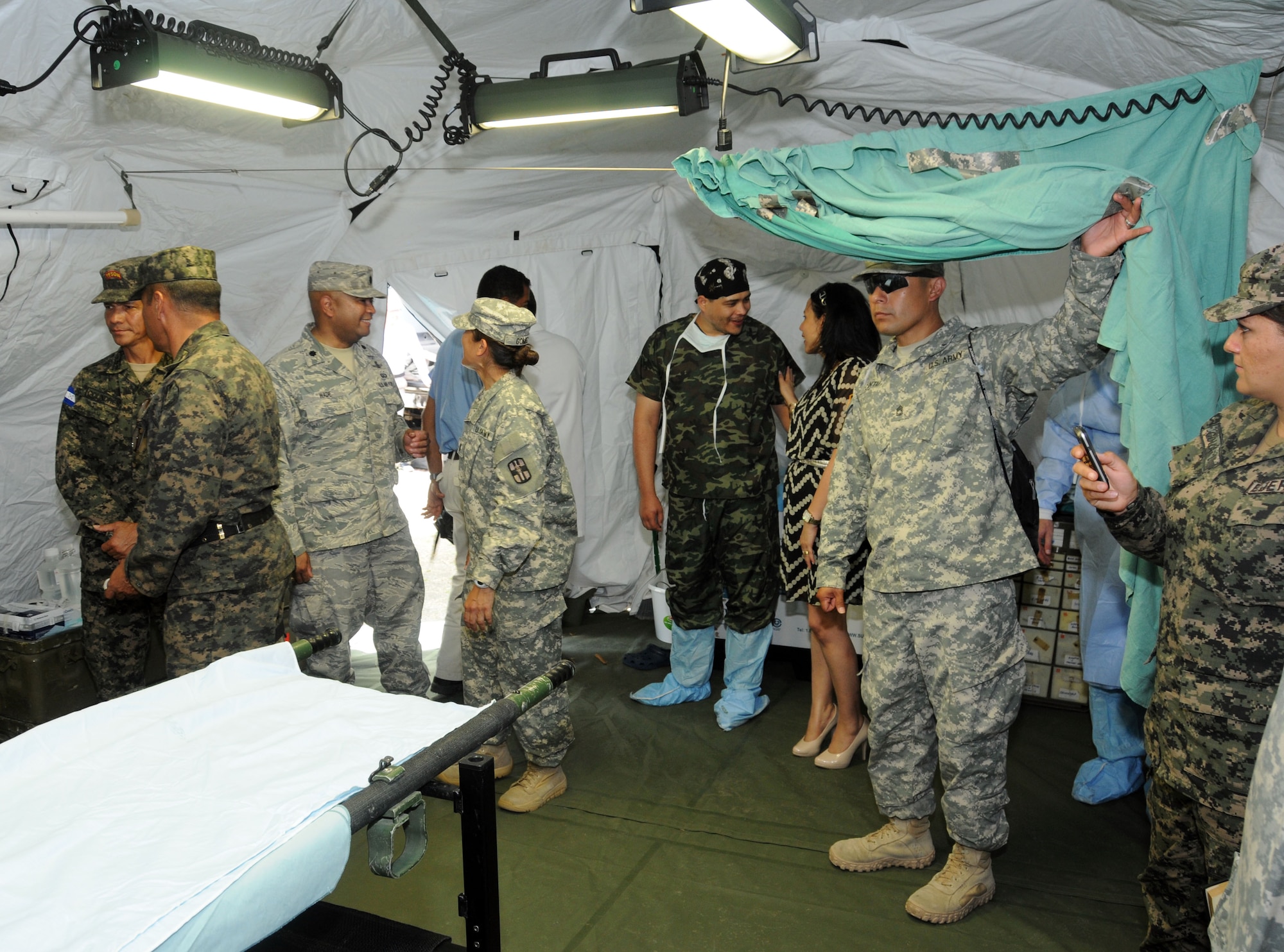 Key leaders from Joint Task Force-Bravo met with Honduran civic and military leaders at the Mobile Surgical Team's site of a Medical Readiness and Training Exercise (MEDRETE) being conducted in the town of Santa Rosa de Copan, Department of Copan, Honduras, May 7, 2014.  The Task Force and Honduran leaders engaged in discussions on how to build on the strong relationship between the U.S. and Honduras, how Joint Task Force-Bravo can continue to partner with Honduras in order to provide assistance to those in need and toured the Mobile Surgical Team's mobile operating room where U.S. and Honduran medical professionals were working side-by-side conducting gall bladder and hernia repair surgeries for eight local citizens.