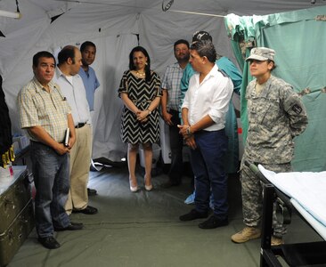 Key leaders from Joint Task Force-Bravo met with Honduran civic and military leaders at the Mobile Surgical Team's site of a Medical Readiness and Training Exercise (MEDRETE) being conducted in the town of Santa Rosa de Copan, Department of Copan, Honduras, May 7, 2014.  The Task Force and Honduran leaders engaged in discussions on how to build on the strong relationship between the U.S. and Honduras, how Joint Task Force-Bravo can continue to partner with Honduras in order to provide assistance to those in need and toured the Mobile Surgical Team's mobile operating room where U.S. and Honduran medical professionals were working side-by-side conducting gall bladder and hernia repair surgeries for eight local citizens.