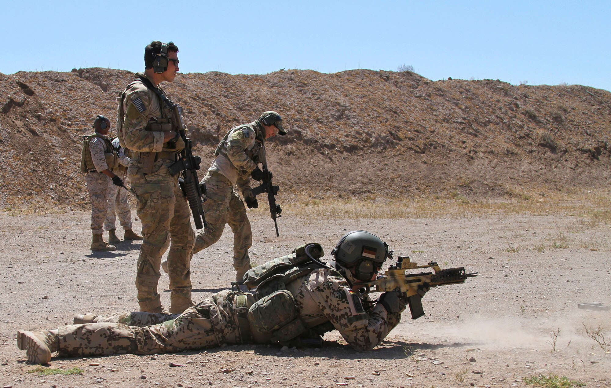 U.S. Airmen and Marines, along with German and Swedish Air Force Rangers, train together on various shooting tactics during Exercise ANGEL THUNDER at Three Points Firing Range in Tucson, Ariz., May 12, 2014.  ANGEL THUNDER is the only exercise in the Department of Defense covering personnel recovery training across the full spectrum of irregular and conventional warfare and has become the world’s largest and most complex personnel recovery exercise. Through the use of joint training, members are able to hone their development of the four core functions of personnel recovery which include preparing, planning, execution, and adaptation. ANGEL THUNDER is designed to provide state of the art rescue training for the total Air Force rescue community, as well as Joint U.S. Military, federal government agencies, local communities, non-governmental agencies and allied nations.  (U.S. Air Force photo by Tech. Sgt. Heather R. Redman/Released)